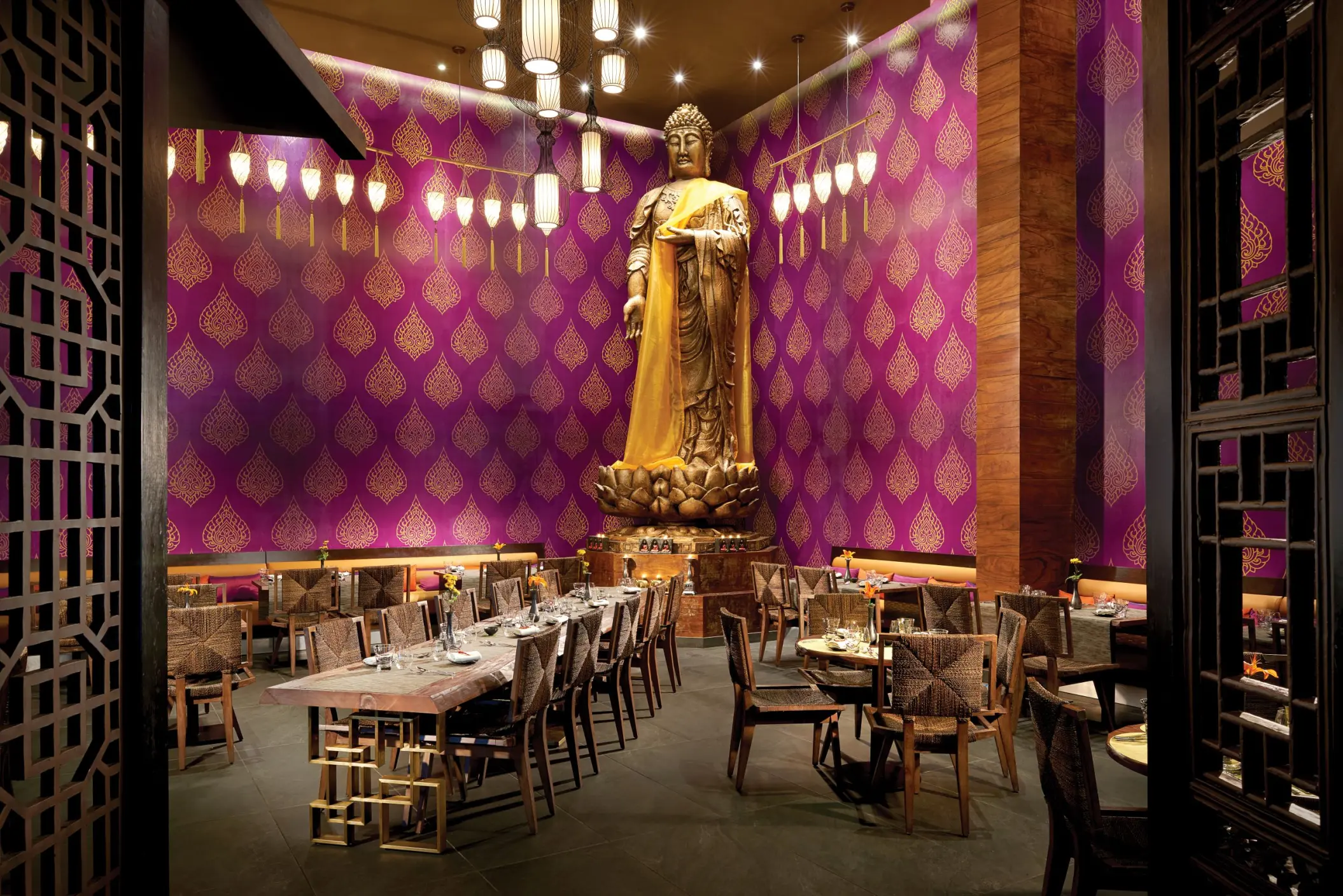 Koh Thai restaurant with large Buddha statue and purple walls at The Fives Beach Hotel, Playa Del Carmen