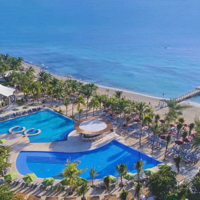 aerial view of the pools and beach at The Fives Beach Hotel & Residences