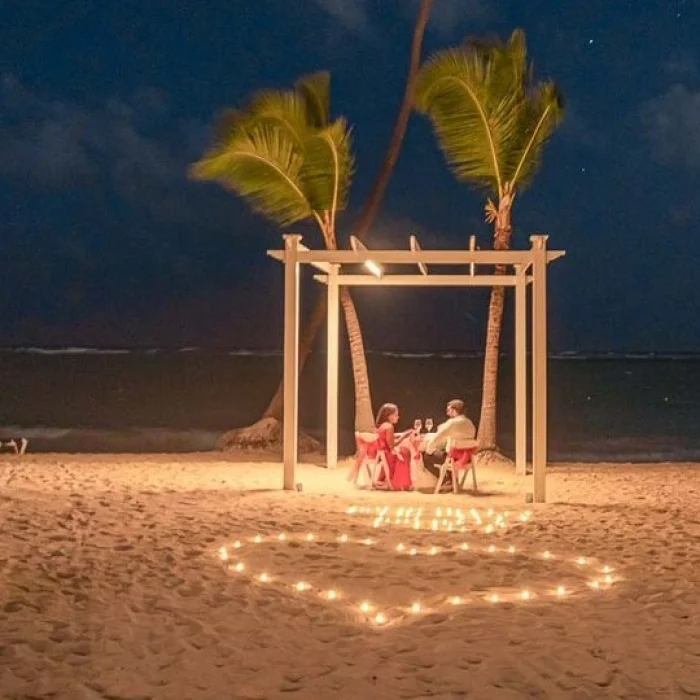 couple having romantic dinner on the beach at TRS Turquesa