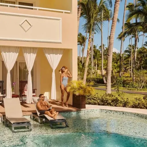 Couple relaxing at a swim-up suite at TRS Turquesa, Punta Cana