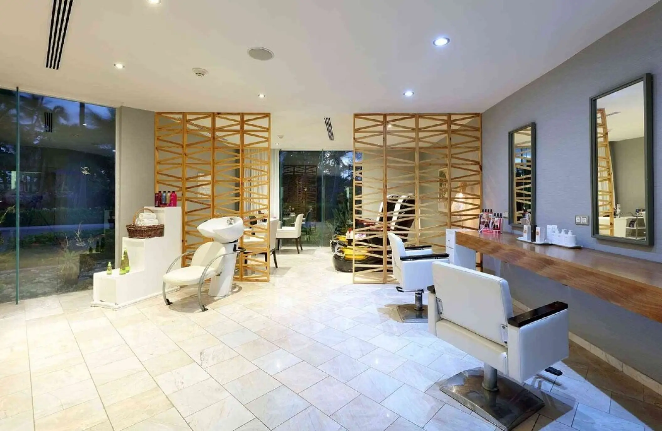 Hair salon with styling chairs and wooden screens at TRS Turquesa, Punta Cana