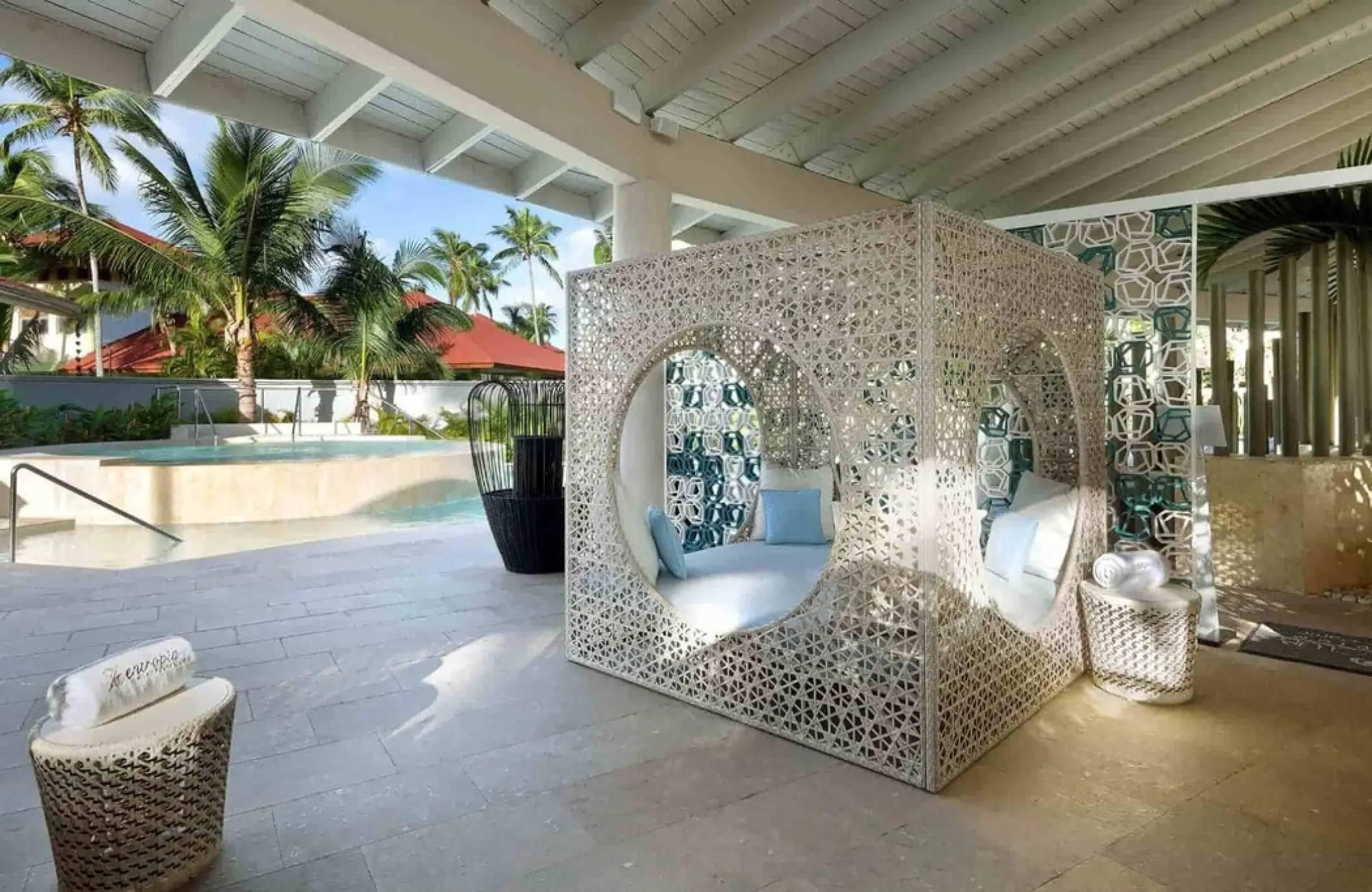 Ornate poolside Bali bed on a covered terrace at TRS Turquesa, Punta Cana