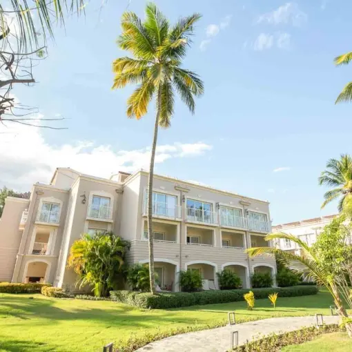 TRS Turquesa resort buildings and landscaped gardens with palm trees, Punta Cana