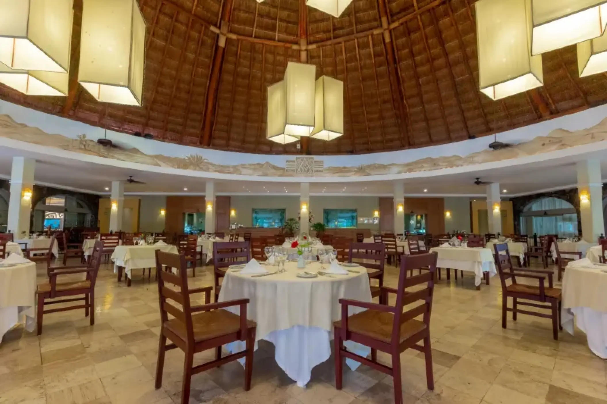 Le Marche restaurant with a high vaulted palapa ceiling and square lanterns at Valentin Imperial, Riviera Maya