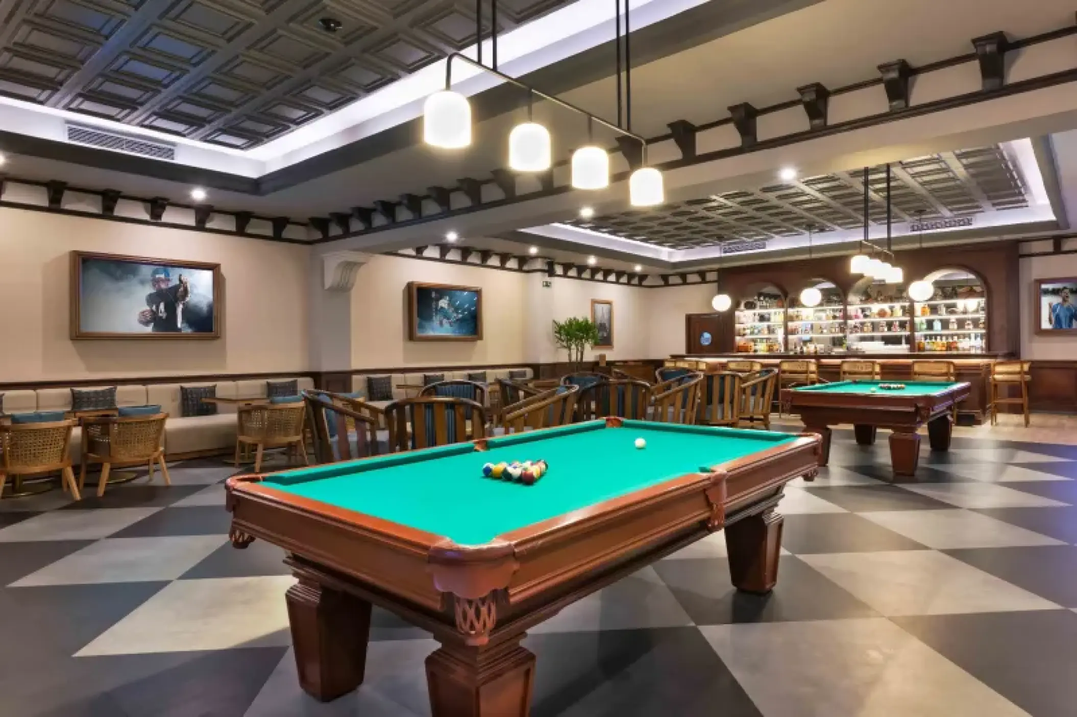 Sports bar with pool tables and checkered floors at Valentin Imperial, Riviera Maya