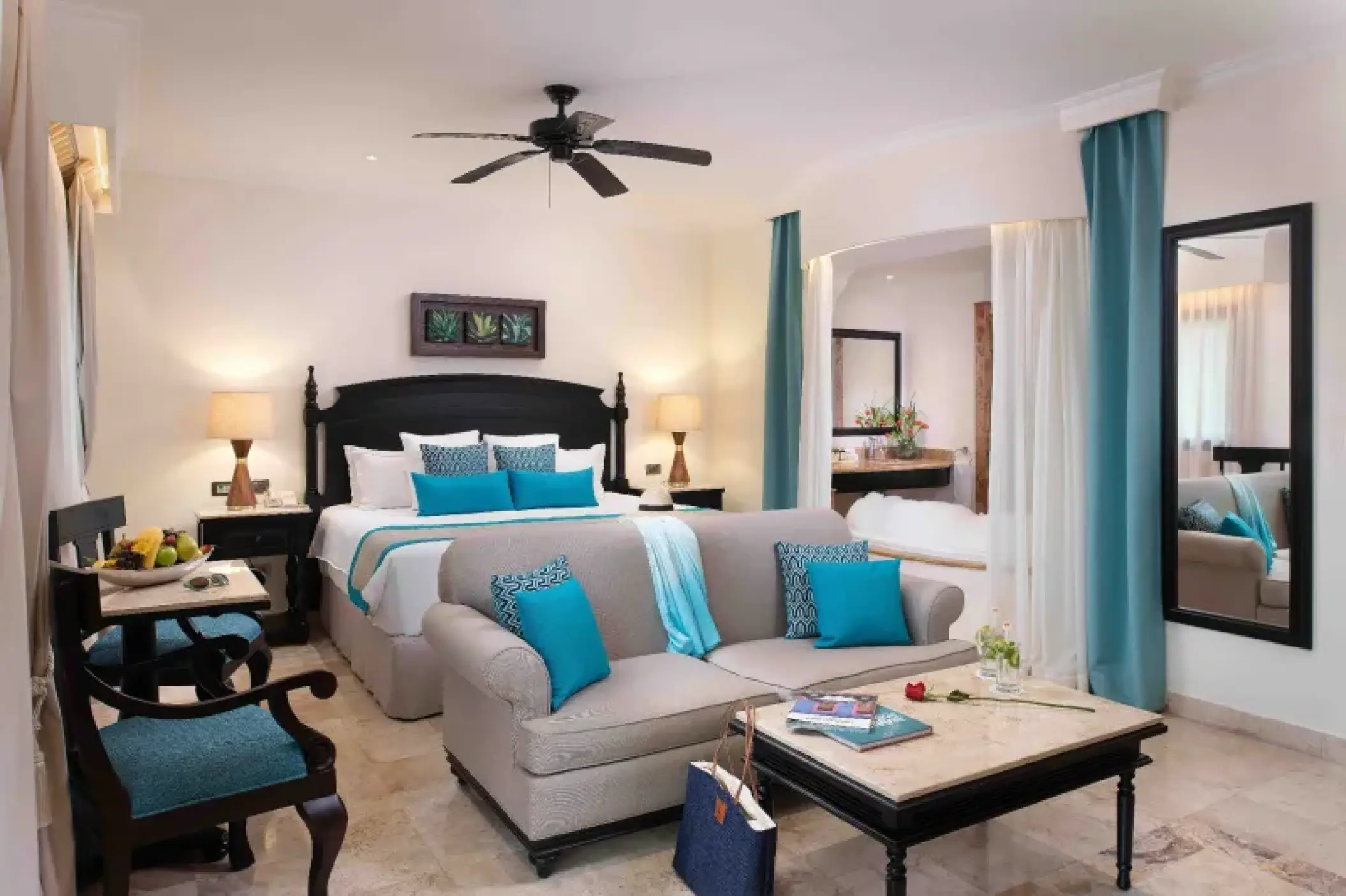 Silver Junior Suite King bedroom with turquoise accents at Valentin Imperial, Riviera Maya