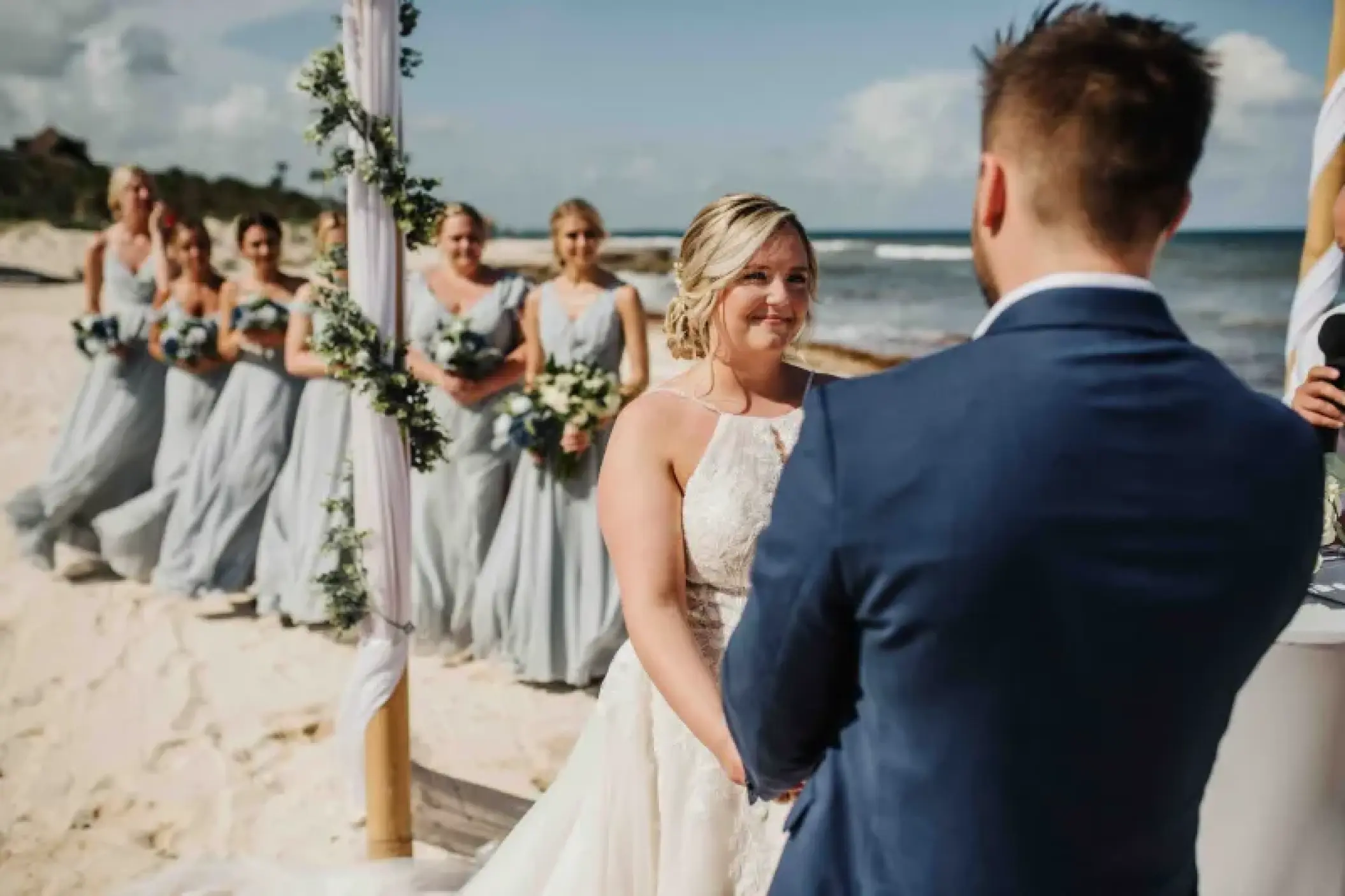 Beachfront wedding ceremony for a couple at Valentin Imperial, Riviera Maya