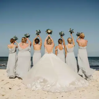 Bride and bridesmaids holding bouquets at Valentin Imperial, Riviera Maya