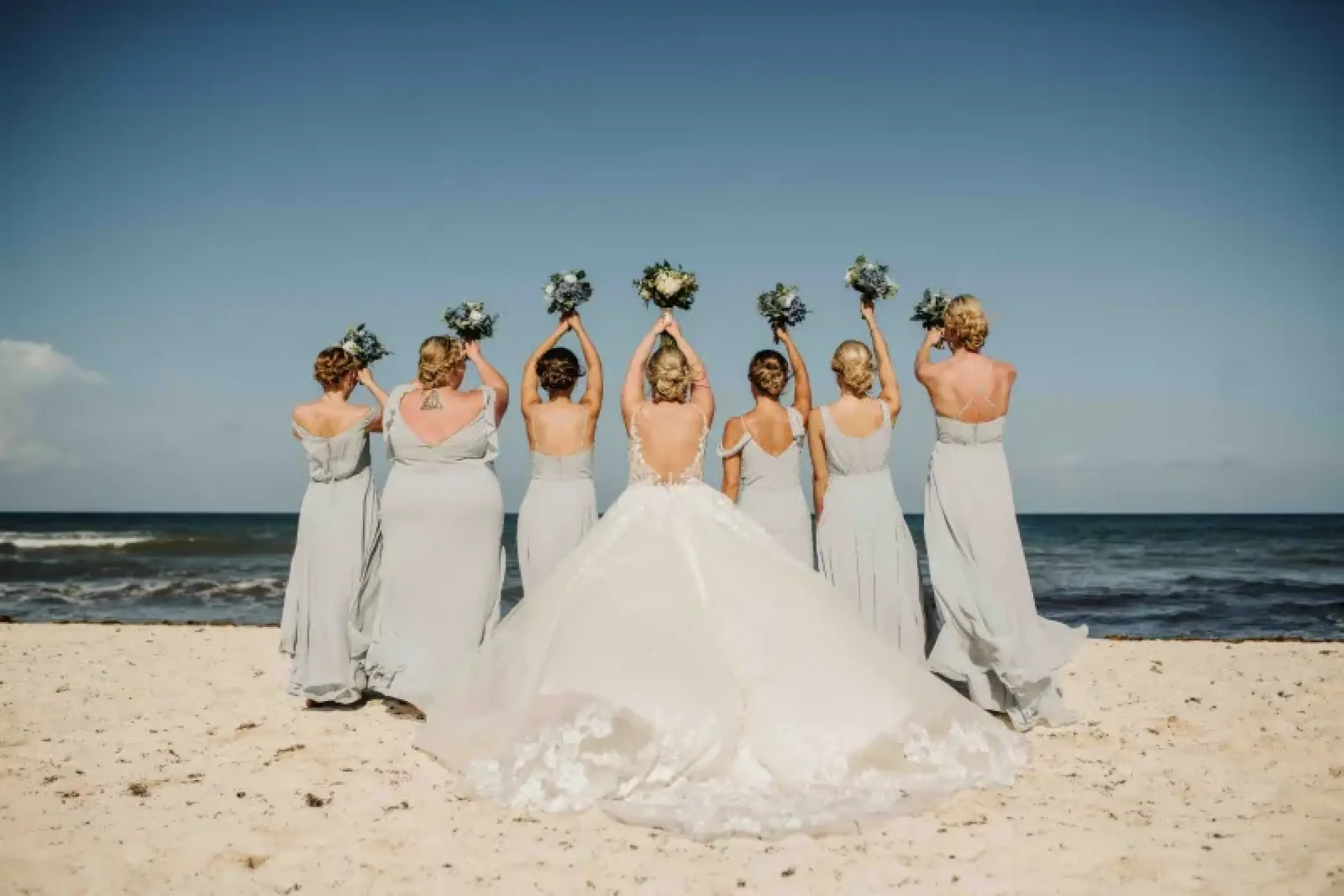 Bride and bridesmaids holding bouquets at Valentin Imperial, Riviera Maya