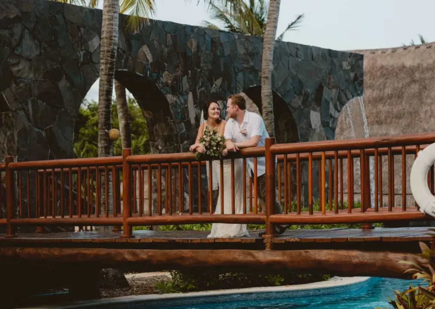 Couple on the bridge ay Valentin Imperial Maya Resort.