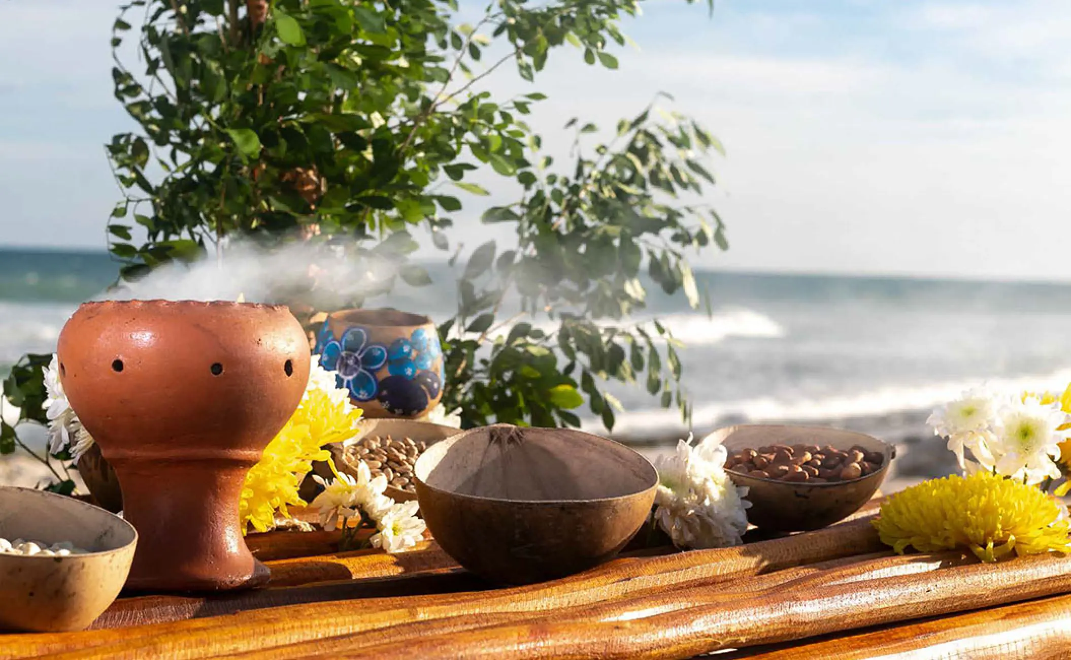 Traditional Mayan wedding ceremony décor with copal incense and flowers at Valentin Imperial, Riviera Maya