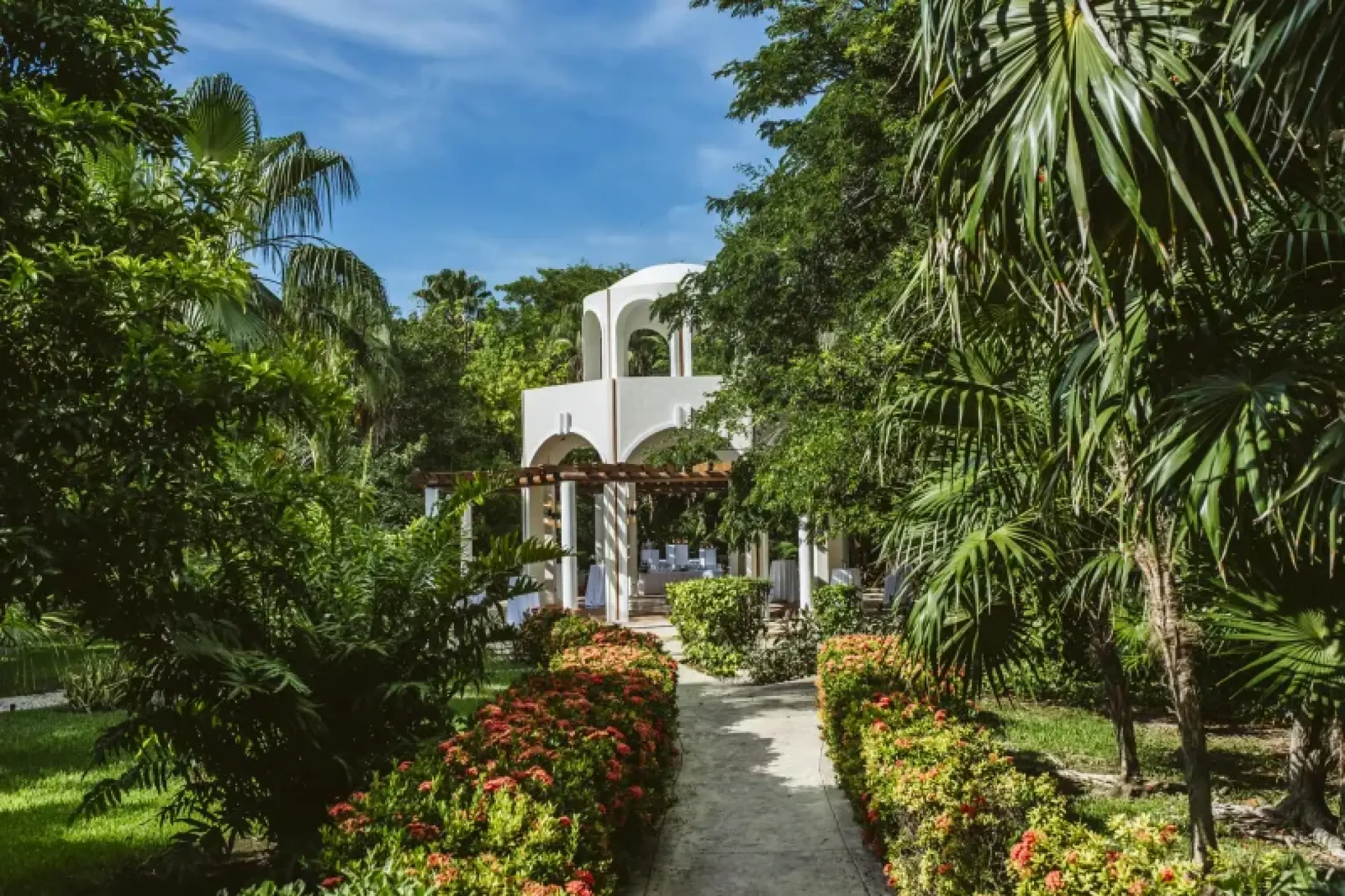 White wedding gazebo ceremony setup at Valentin Imperial, Riviera Maya