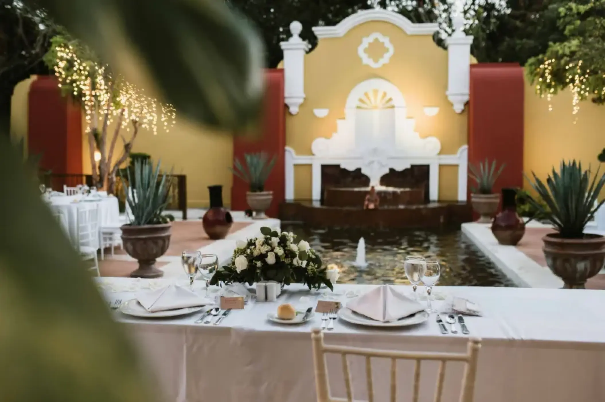 La Hacienda Terrace wedding reception by the fountain at Valentin Imperial, Riviera Maya