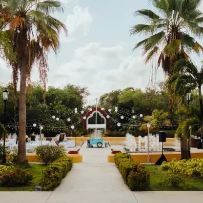 Las Fuentes wedding reception venue with fountains and palm trees at Valentin Imperial, Riviera Maya