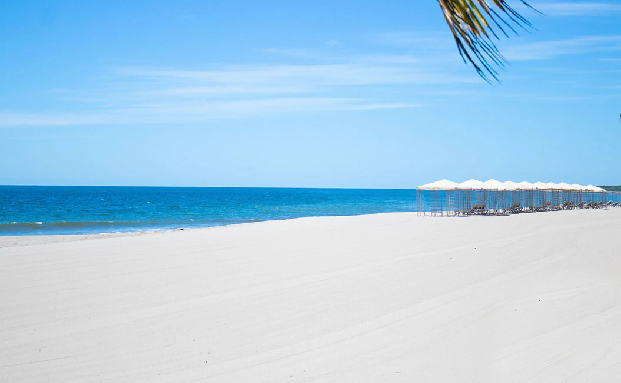 White sand beach with cabanas at Velas Vallarta, Puerto Vallarta