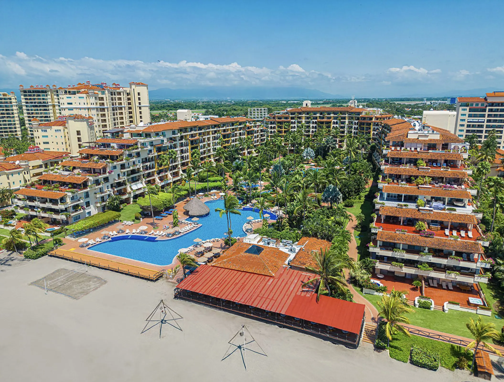 Aerial view of Velas Vallarta buildings, swimming pool, and tropical grounds, Puerto Vallarta