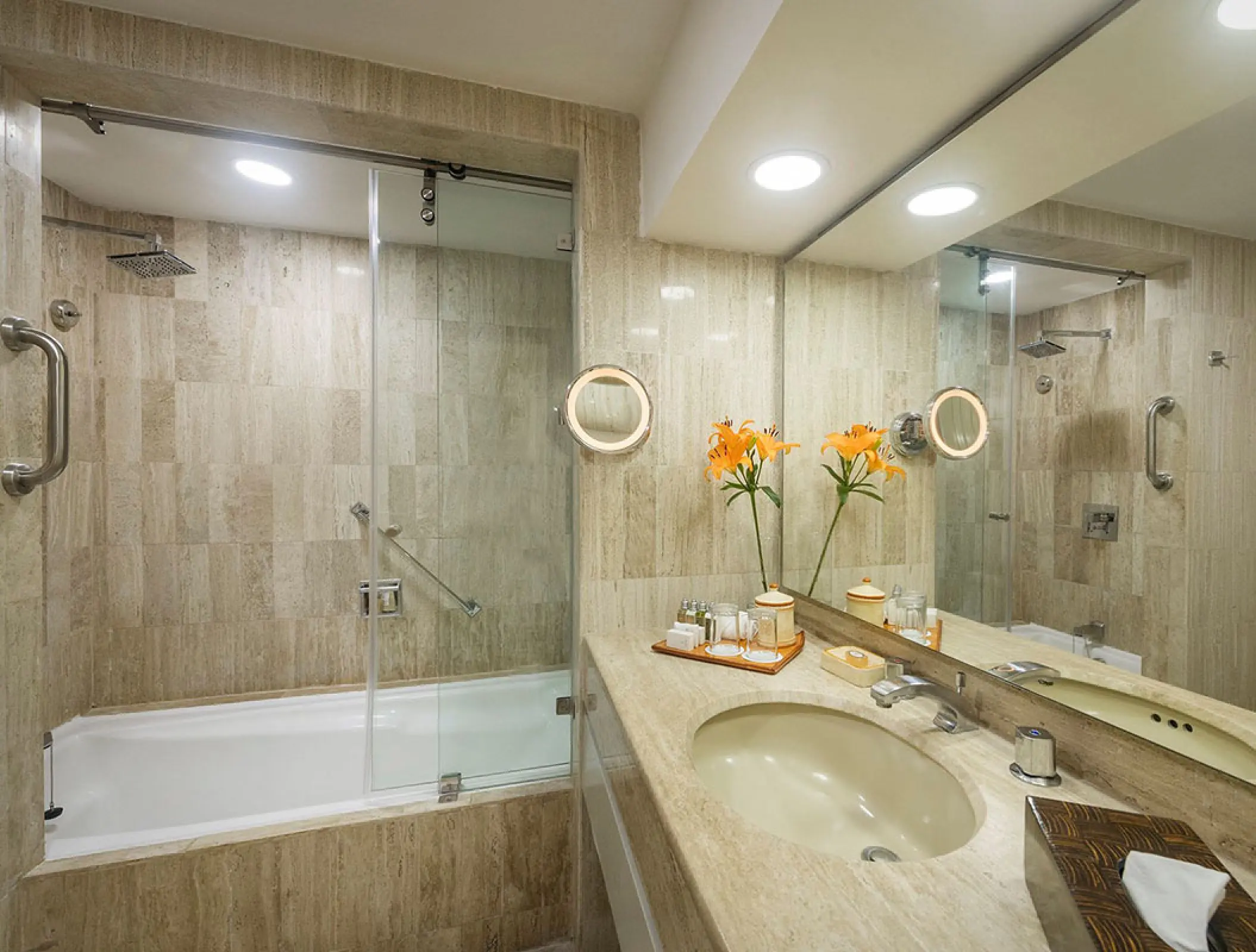 Suite bathroom with marble tiling and bathtub at Velas Vallarta, Puerto Vallarta
