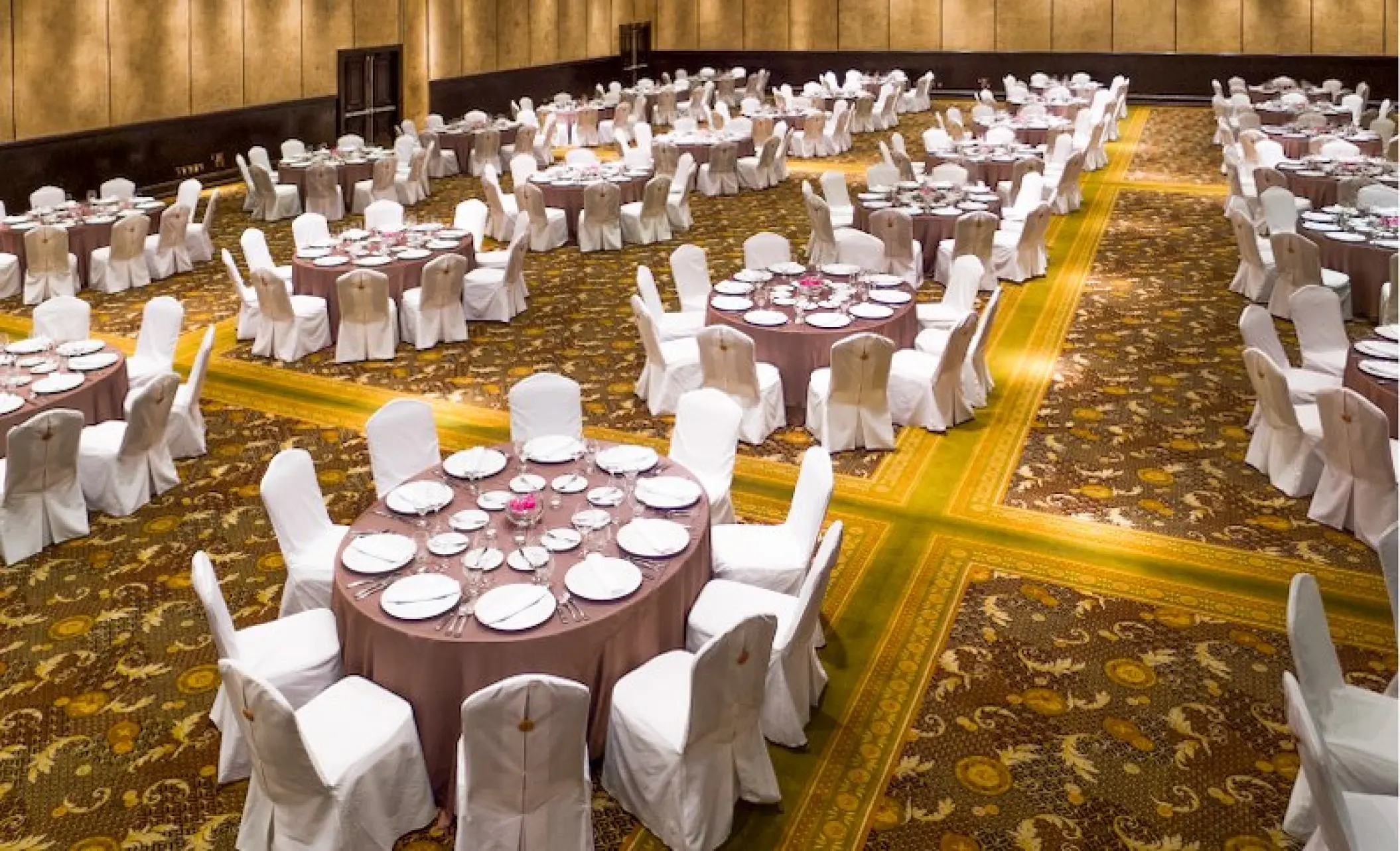 Indoor wedding reception with circular tables at Velas Vallarta, Puerto Vallarta