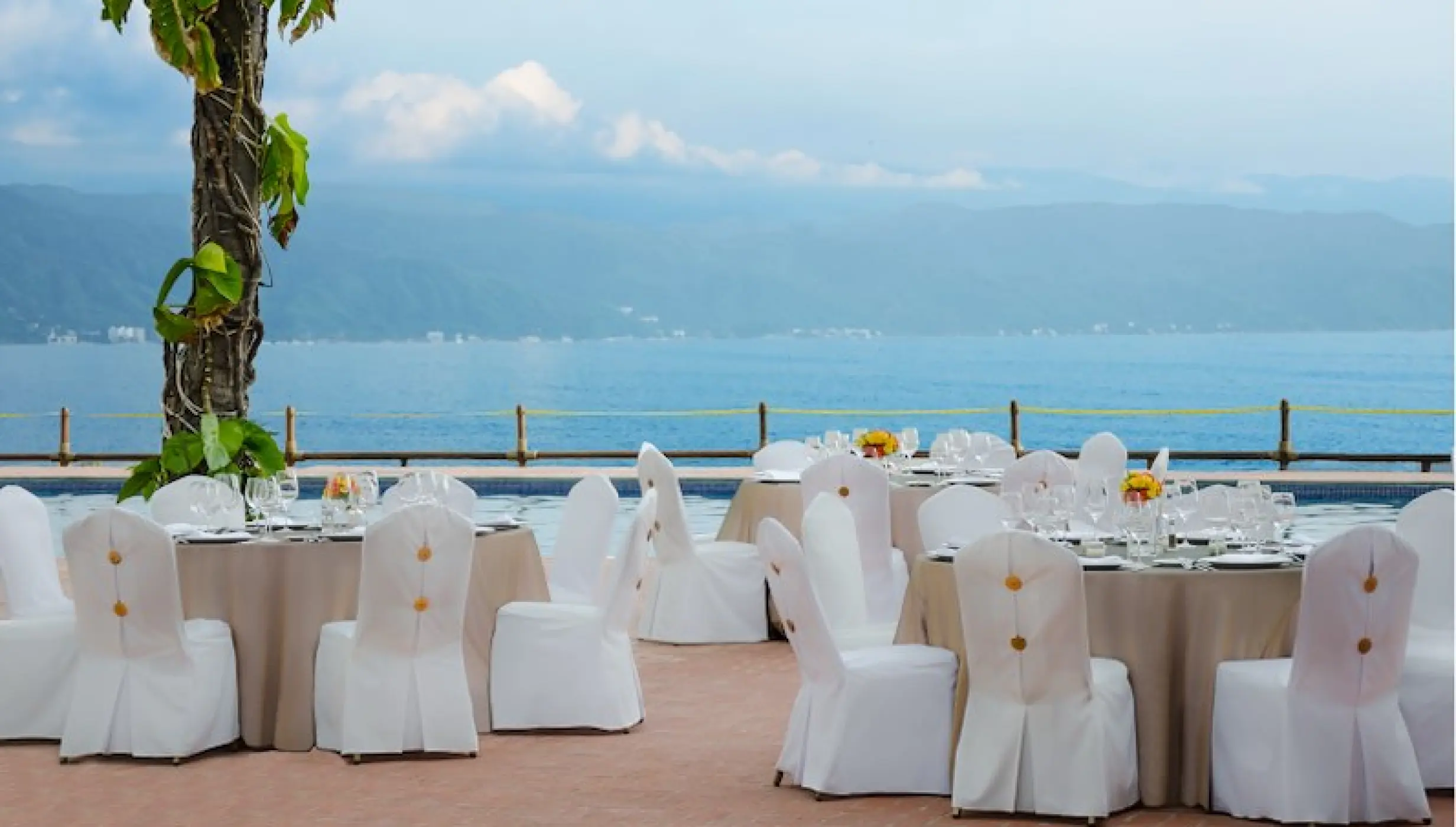 Pool terrace wedding reception setup at Velas Vallarta, Puerto Vallarta
