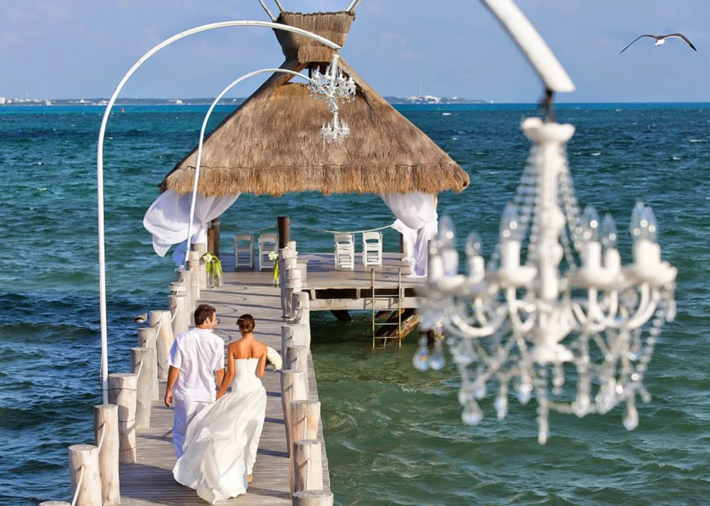 bride and groom at the pier venue at Villa del Palmar Cancun