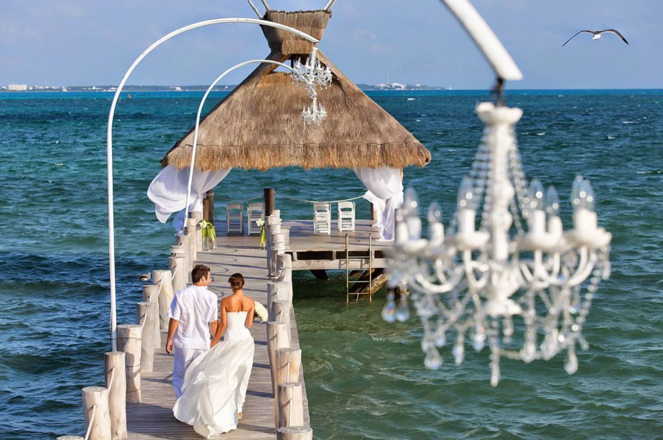 bride and groom at the pier venue at Villa del Palmar Cancun