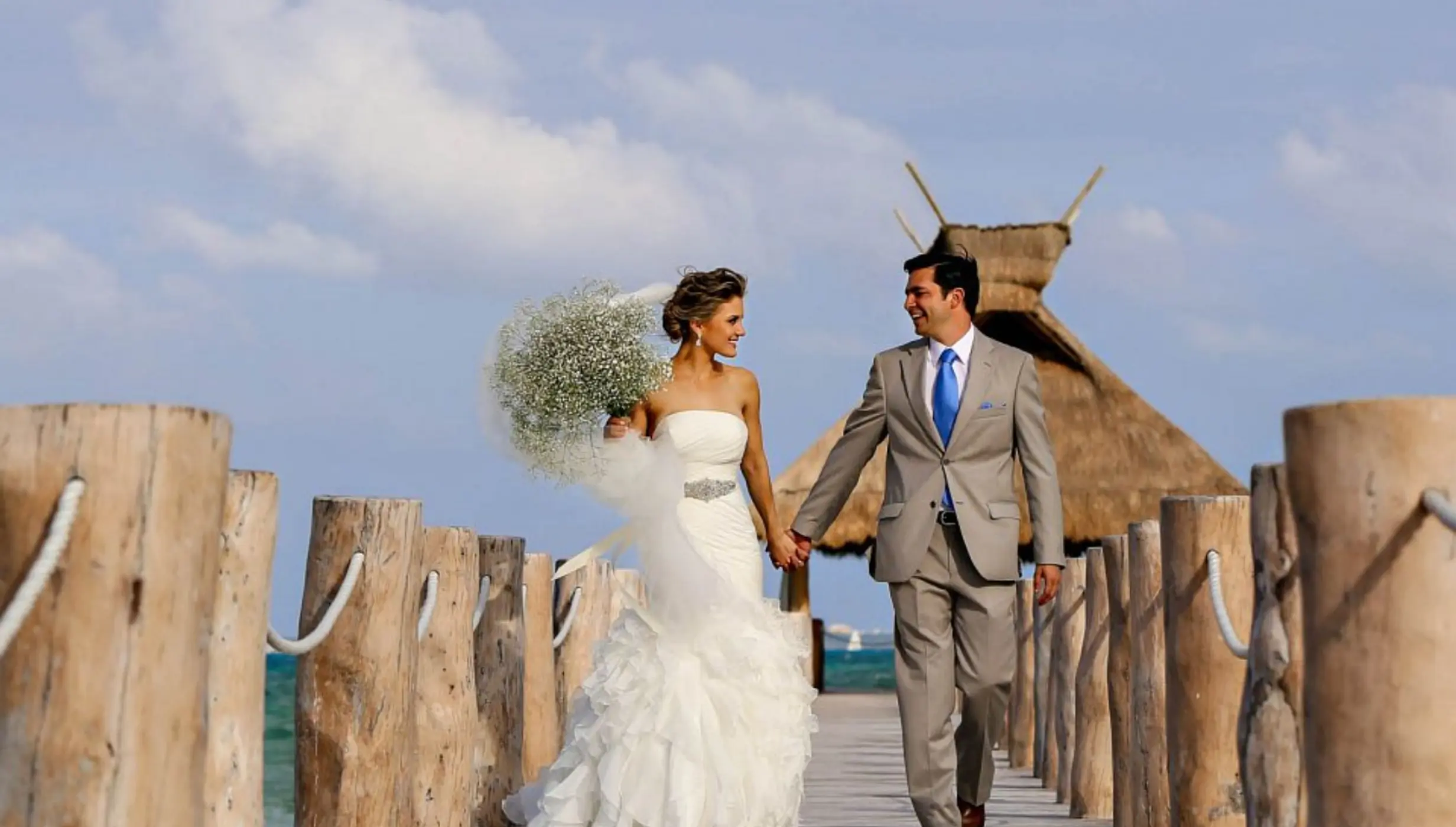 bride and groom at the pier venue at Villa del Palmar Cancun