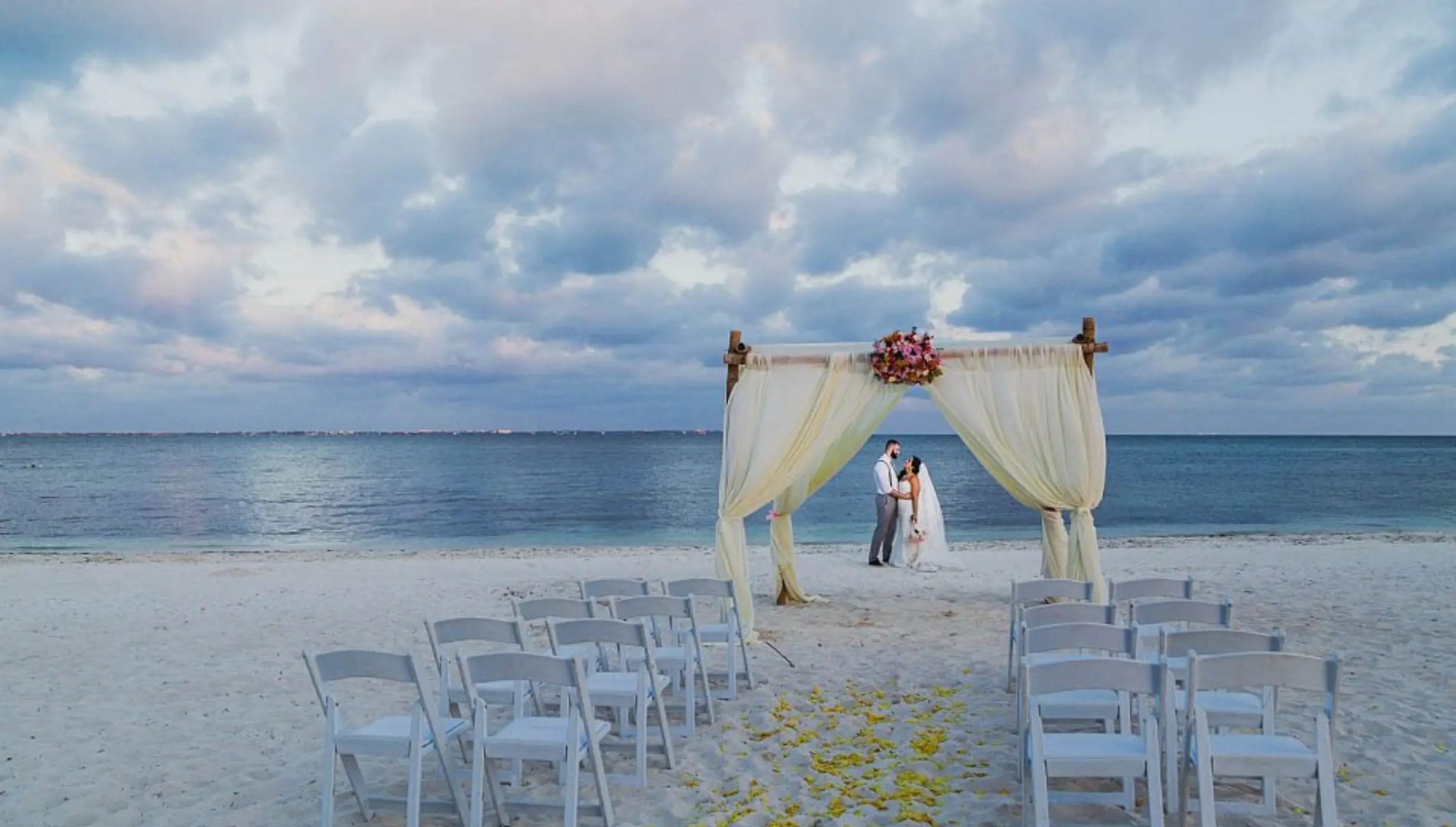 bride and groom on the beach at Villa del Palmar Cancun