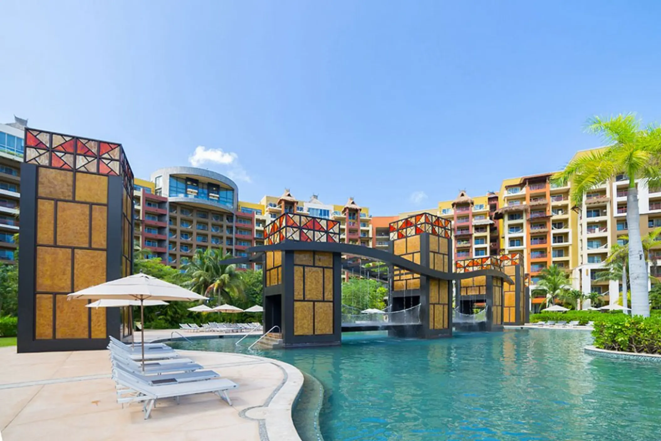 Water bridge and waterfall pool feature at Villa del Palmar Cancun