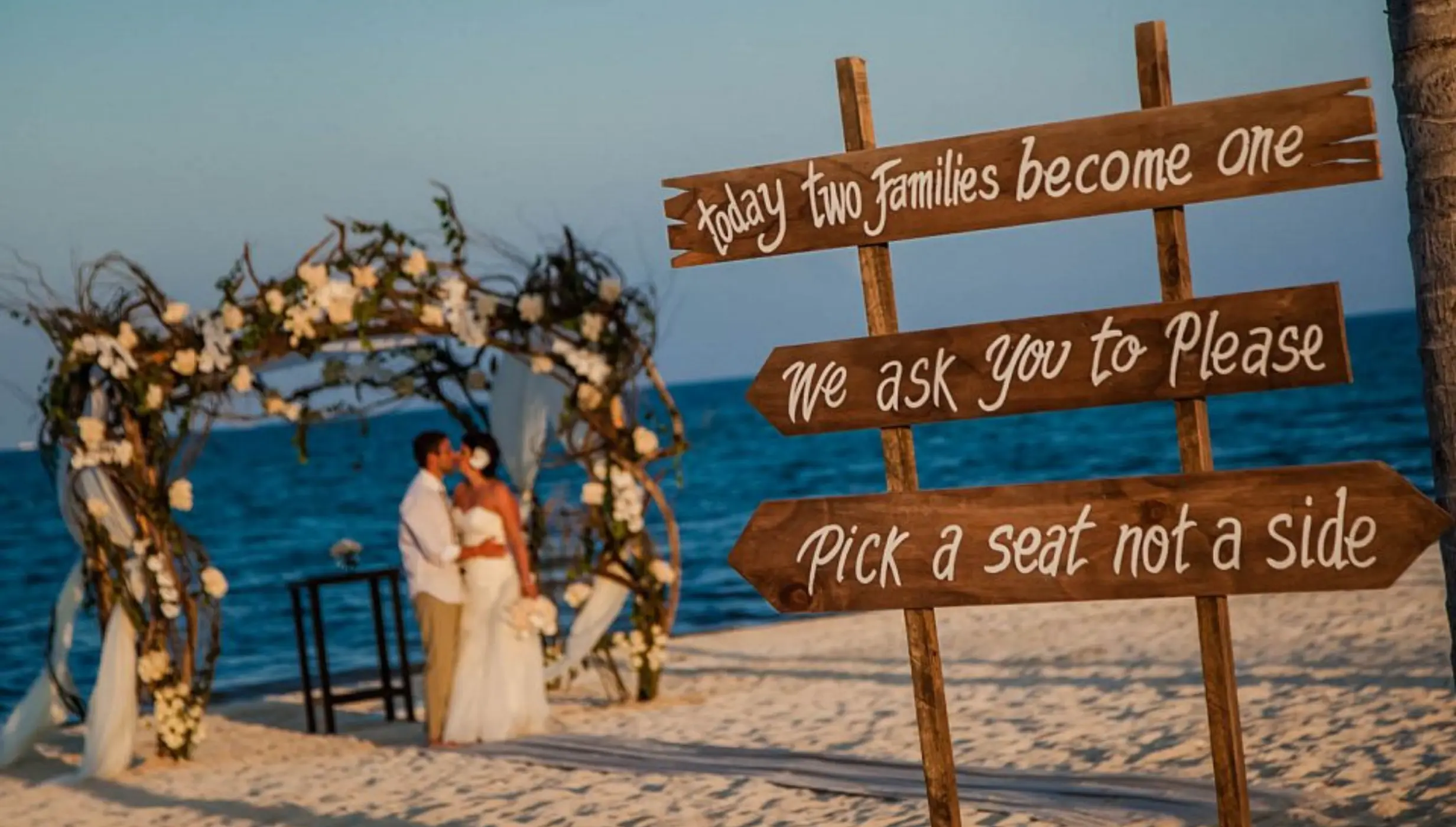 capricos beach venue with the bride and groom in the background at Villa del Palmar Cancun