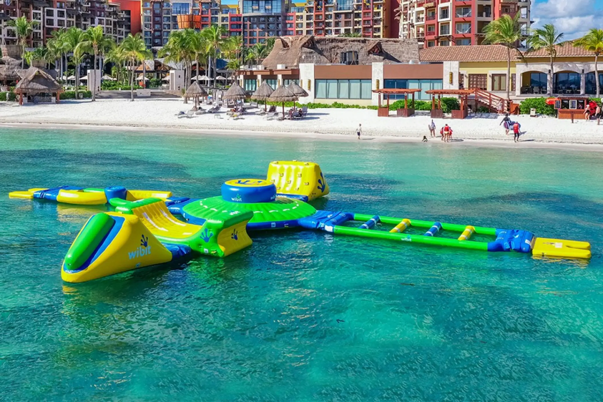 Inflatable aqua park in the turquoise ocean at Villa del Palmar Cancun