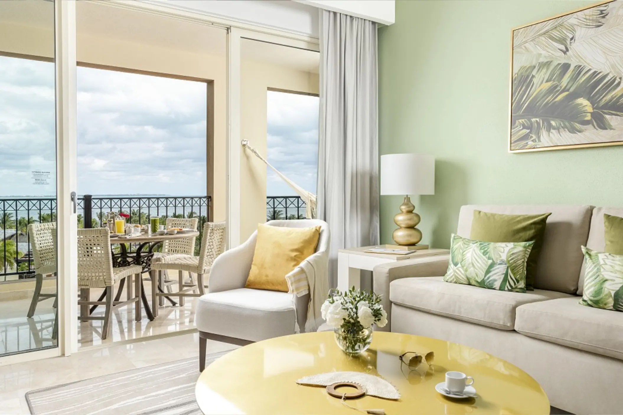 Living area and balcony in the One Bedroom Suite at Villa del Palmar Cancun