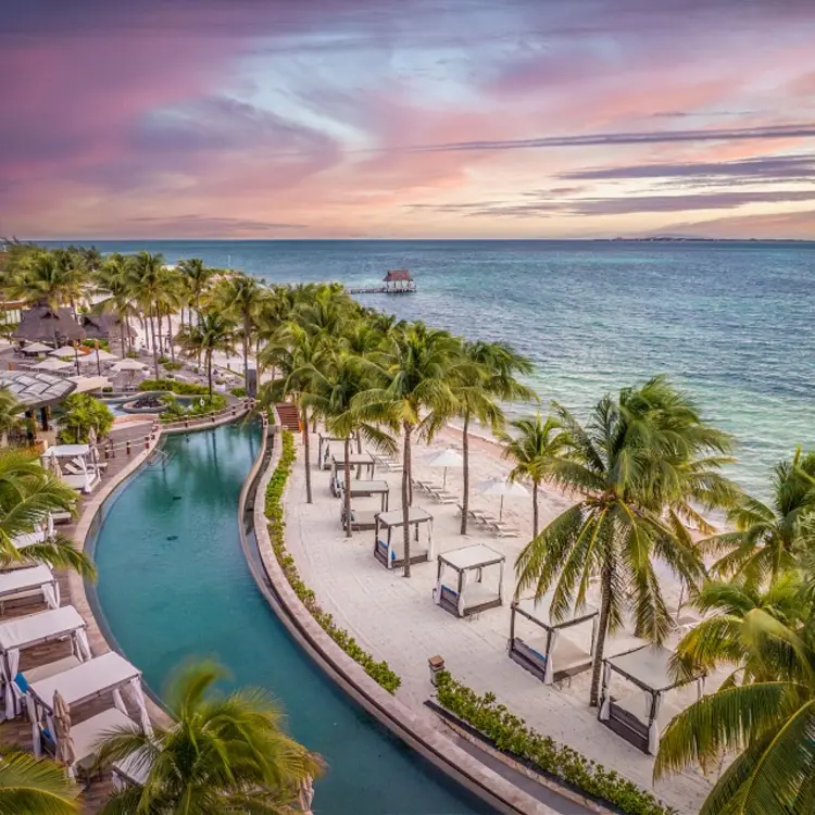 Oceanfront pool and beach cabanas at Villa del Palmar, Cancun