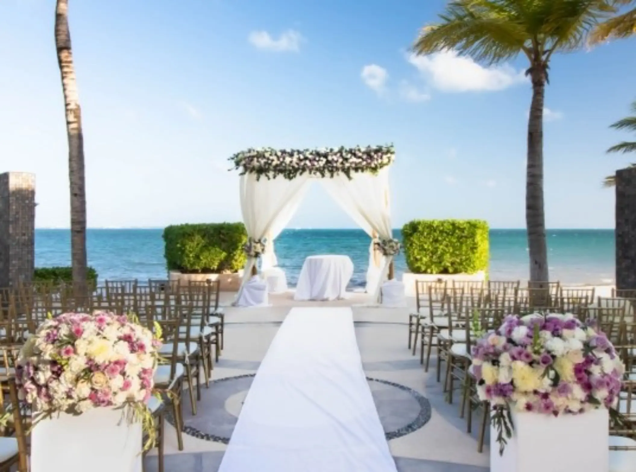 Patio wedding ceremony setup at Villa del Palmar Cancun overlooking the ocean, Cancun