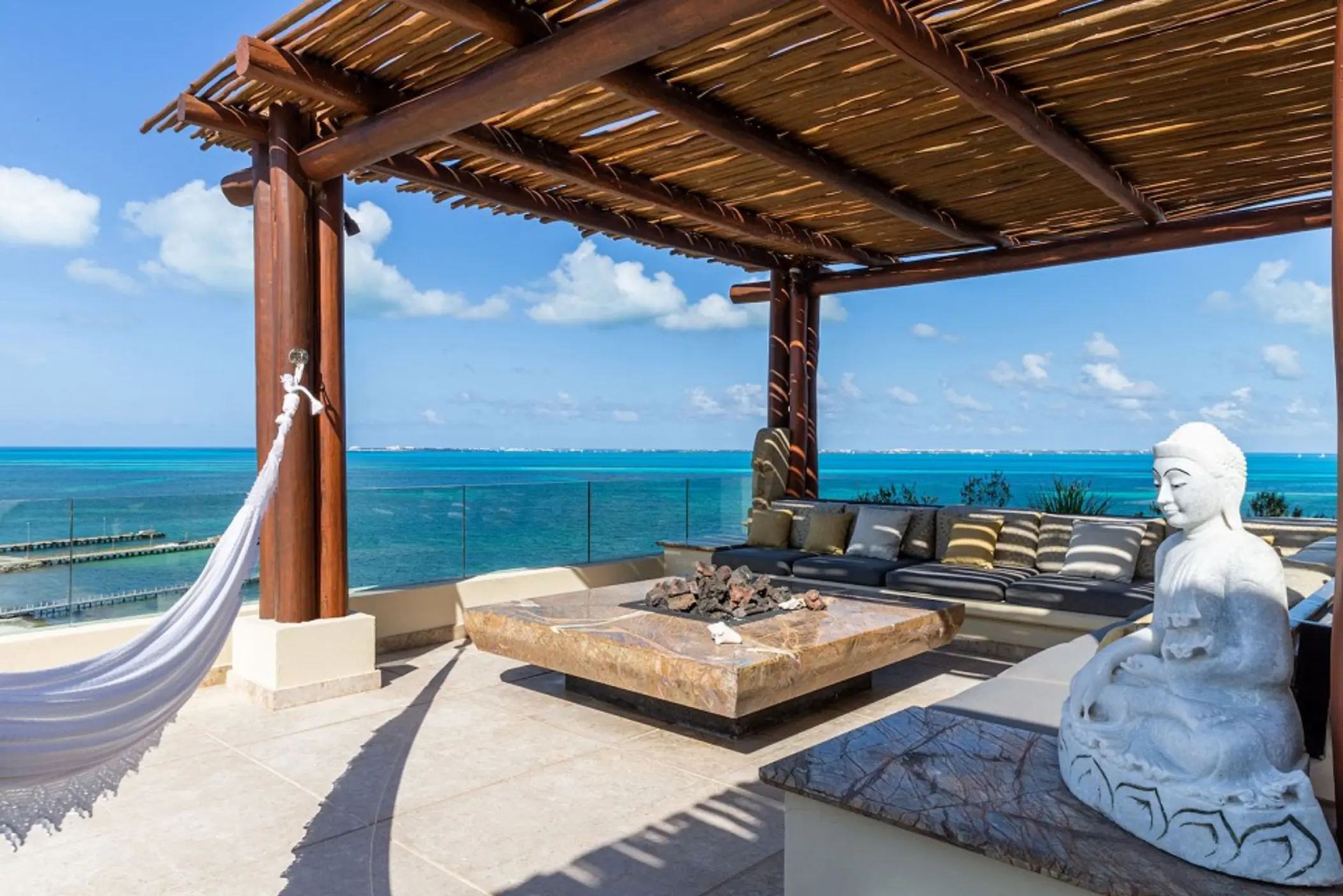 Grand Penthouse private terrace with hammock and ocean views at Villa del Palmar Cancun