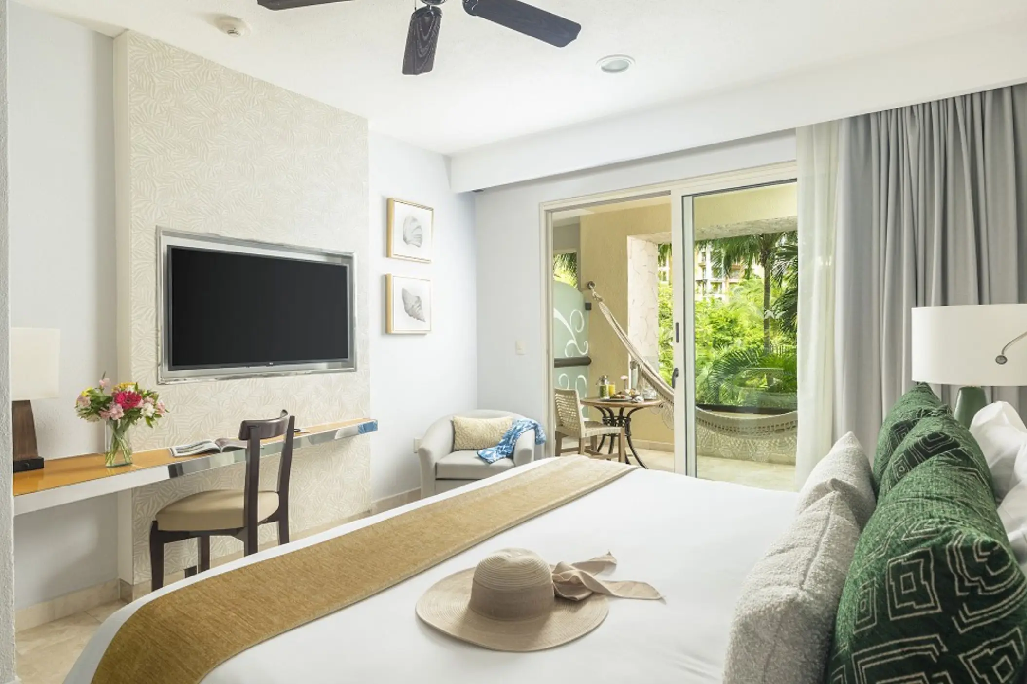 Suite with king bed and private balcony at Villa del Palmar Cancun