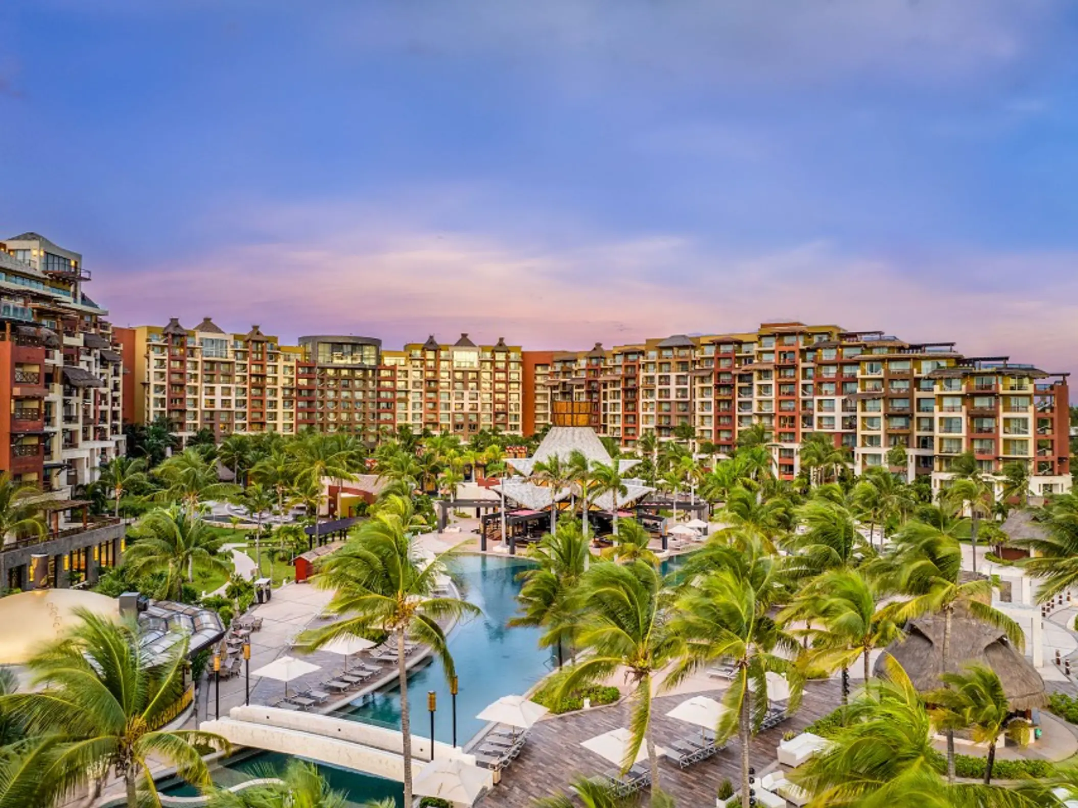 Elevated view of the pools and palm trees at Villa del Palmar Cancun