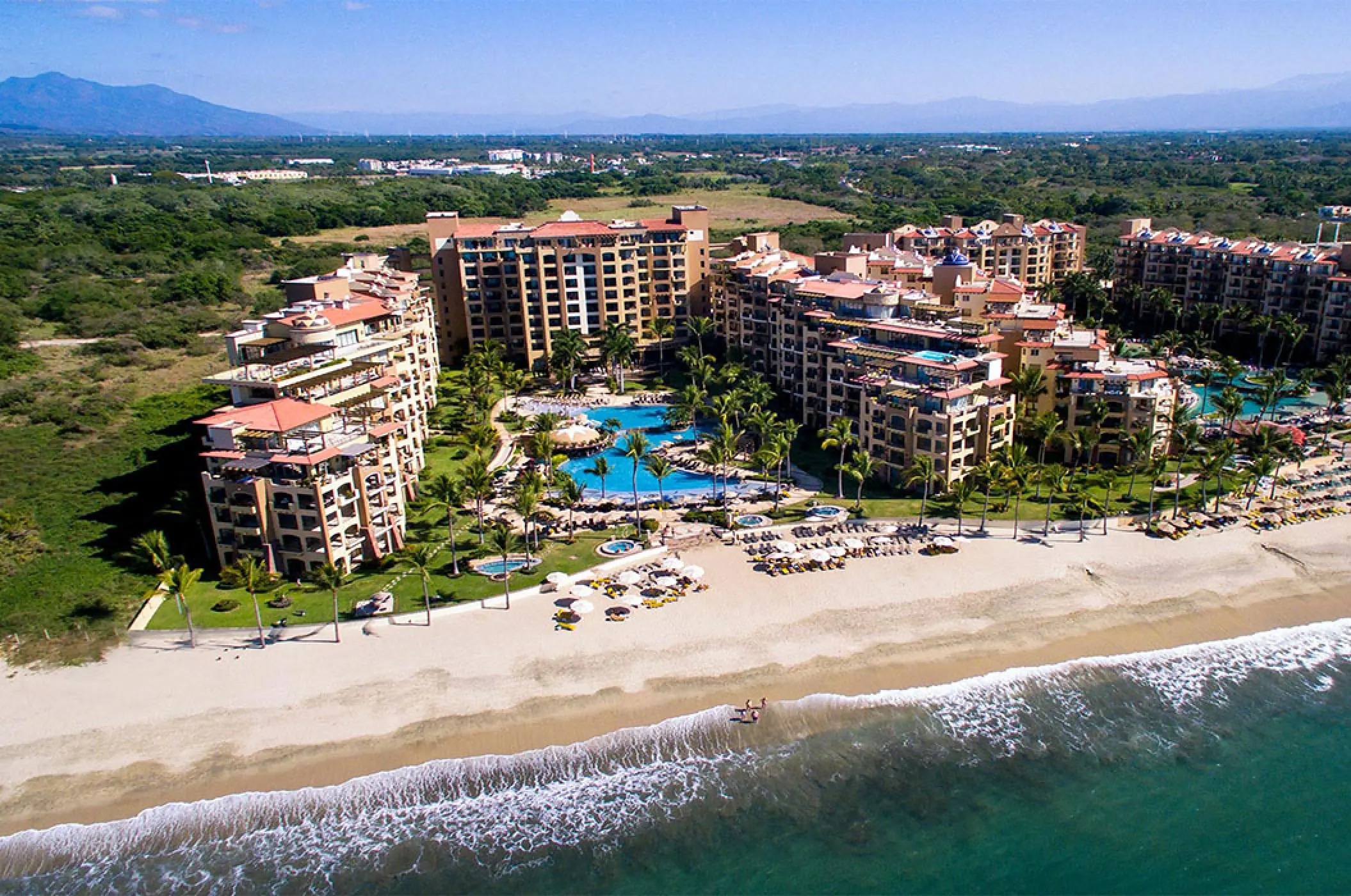 Aerial view of Villa La Estancia Riviera Nayarit beachfront buildings and pool complex, Puerto Vallarta