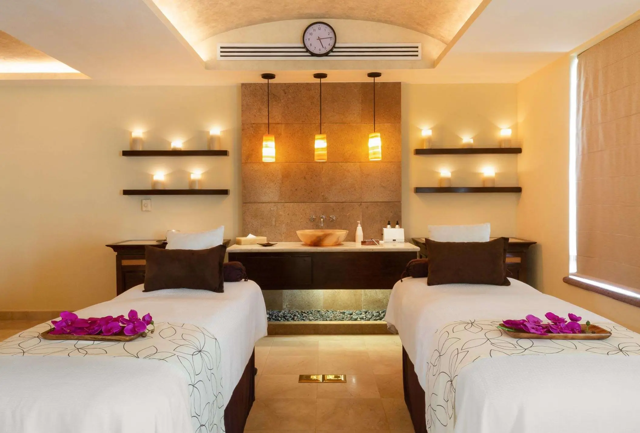 Couples massage room with purple flowers on the beds at Villa La Estancia Riviera Nayarit, Puerto Vallarta