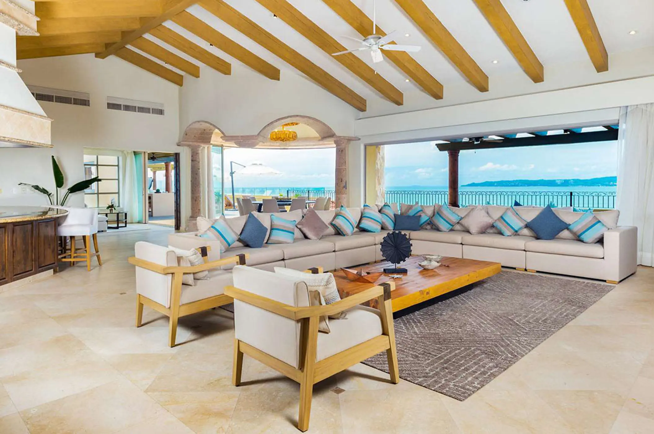 Penthouse living area with wood-beamed ceilings and ocean views at Villa La Estancia Riviera Nayarit, Puerto Vallarta