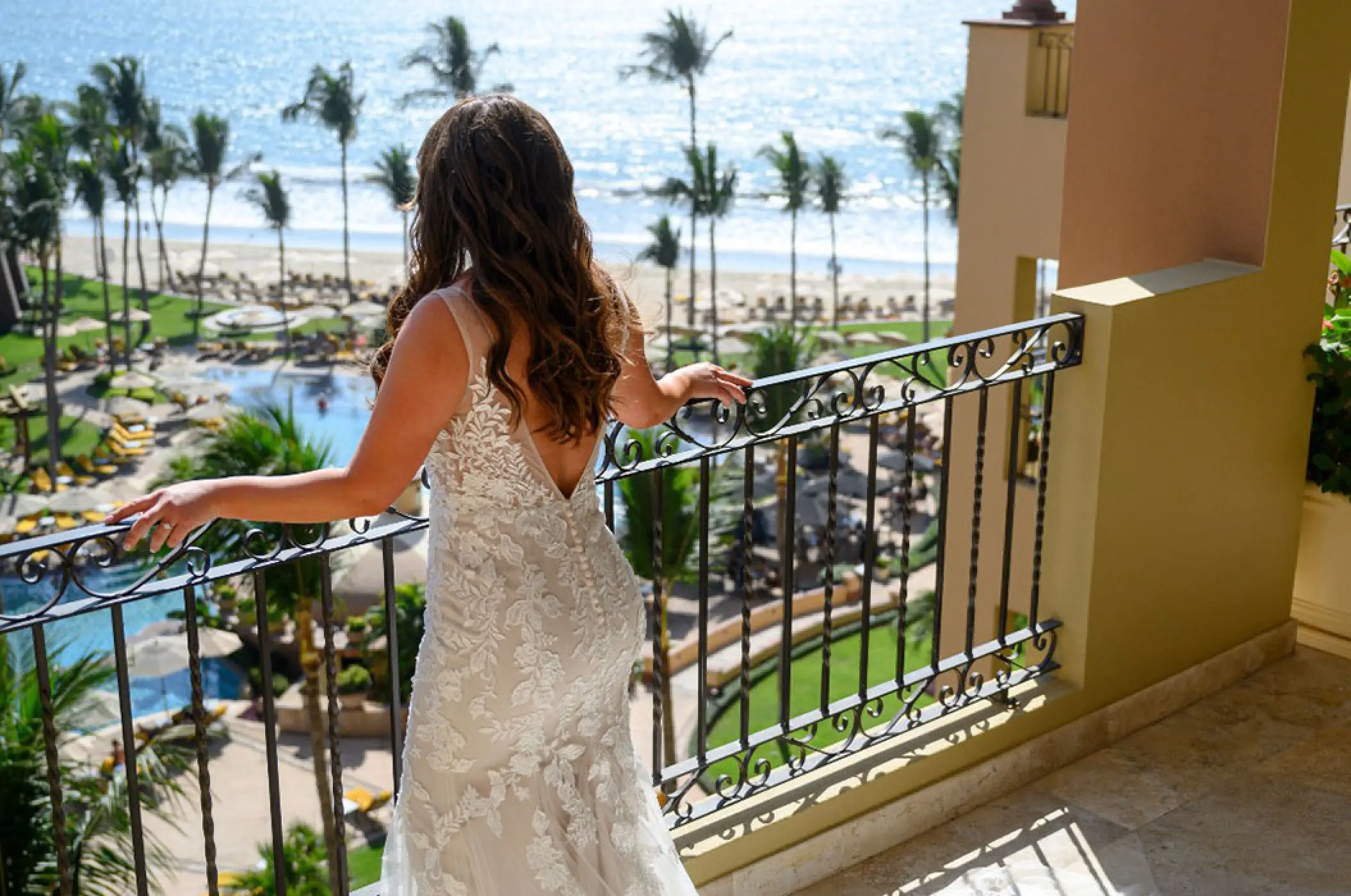 Bride on a balcony overlooking the beach and grounds of Villa La Estancia Riviera Nayarit, Puerto Vallarta