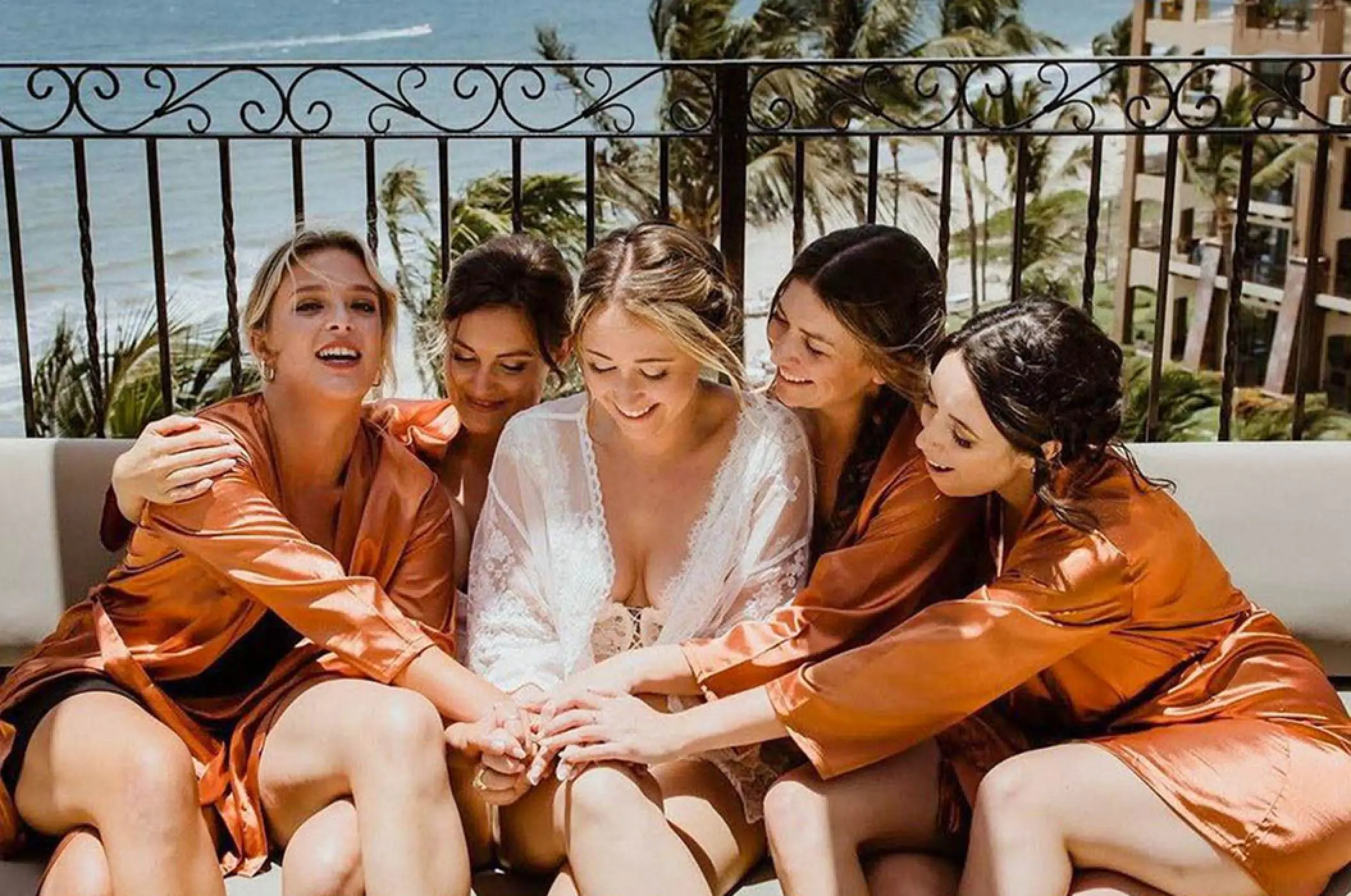 Bride and bridesmaids in satin robes getting ready at Villa La Estancia, Puerto Vallarta