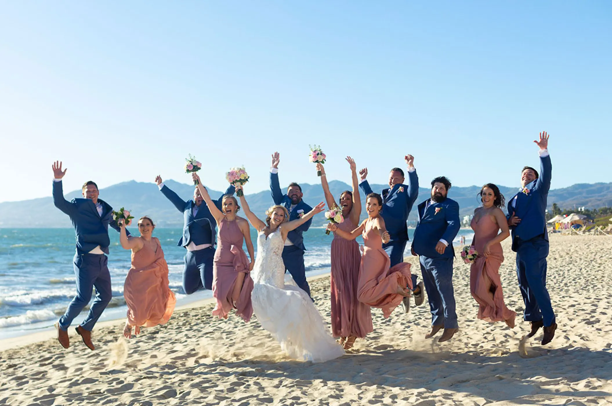 Wedding party jumping on the beach at Villa La Estancia Riviera Nayarit, Puerto Vallarta