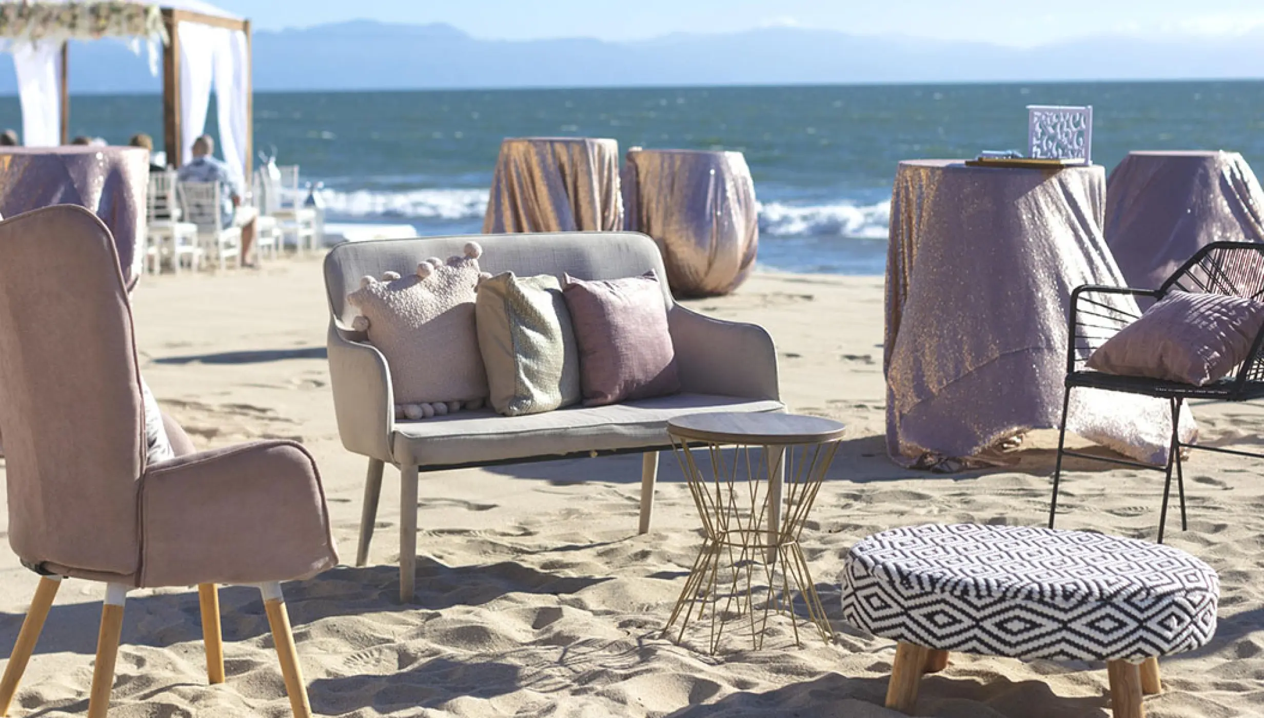 Beach wedding reception lounge with sofa and cocktail tables at Villa La Estancia Riviera Nayarit, Puerto Vallarta