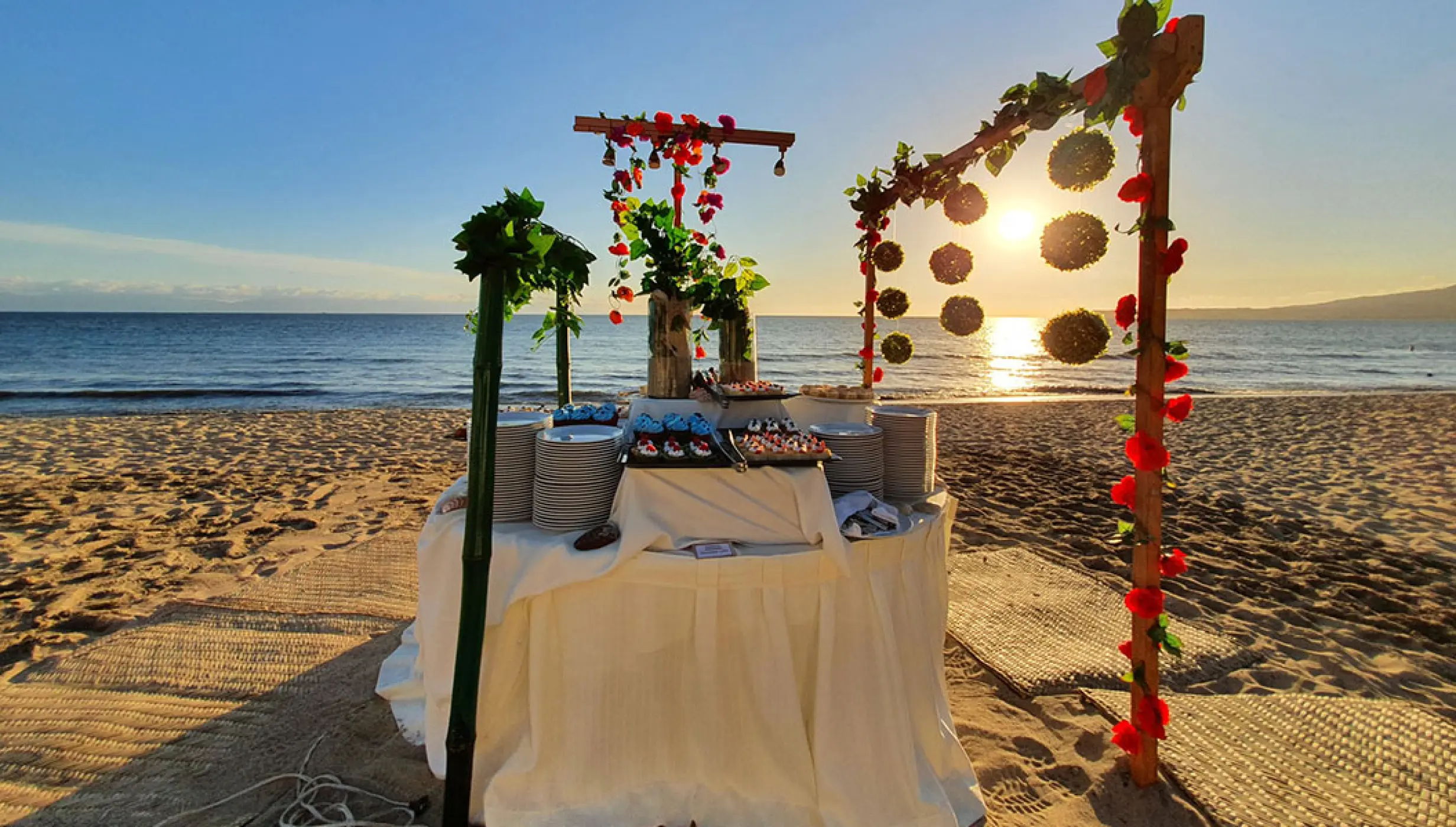 Beach wedding reception buffet setup at sunset at Villa La Estancia Riviera Nayarit, Puerto Vallarta