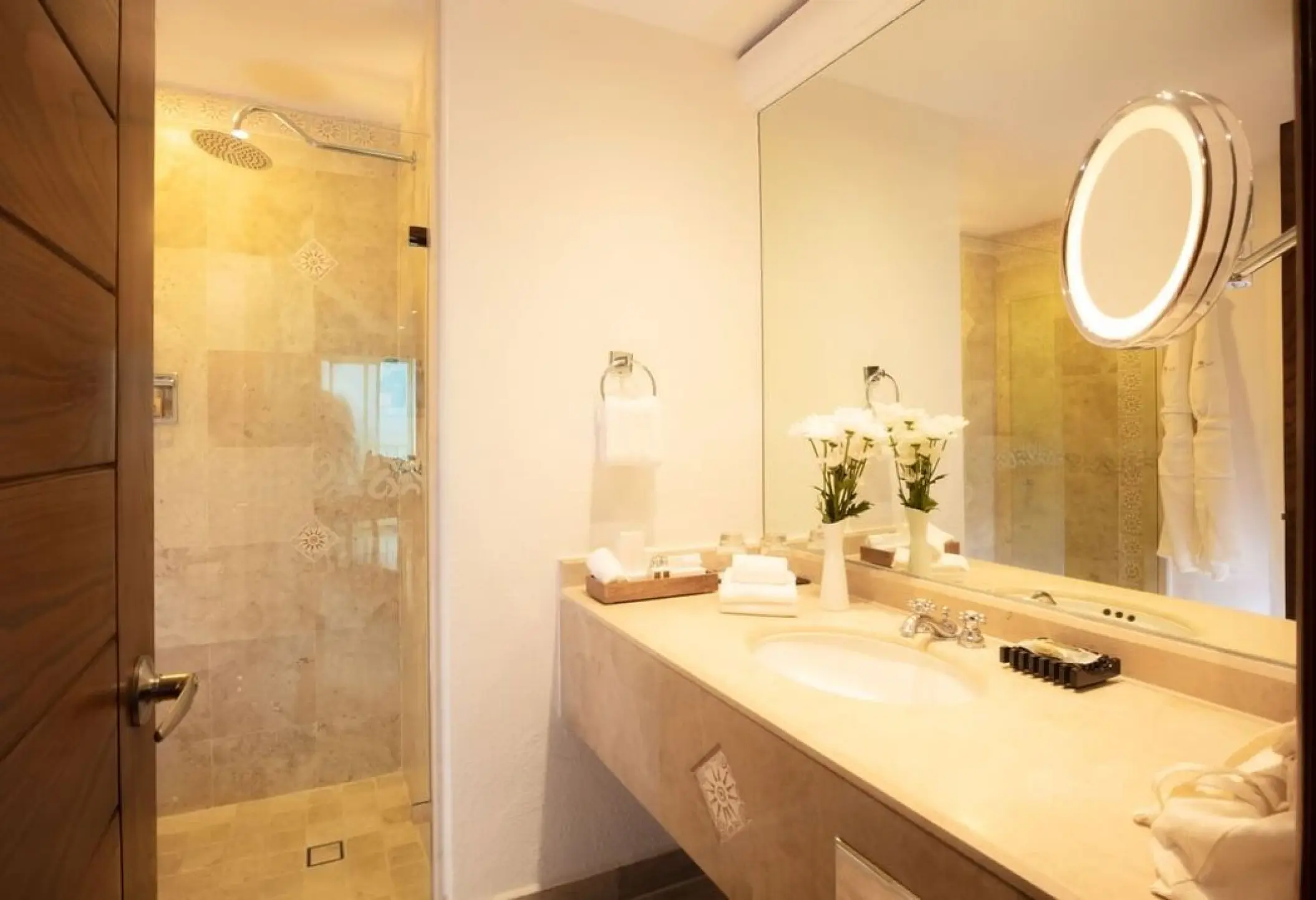 Modern suite bathroom with walk-in shower and vanity at Villa Premiere Boutique Hotel, Puerto Vallarta