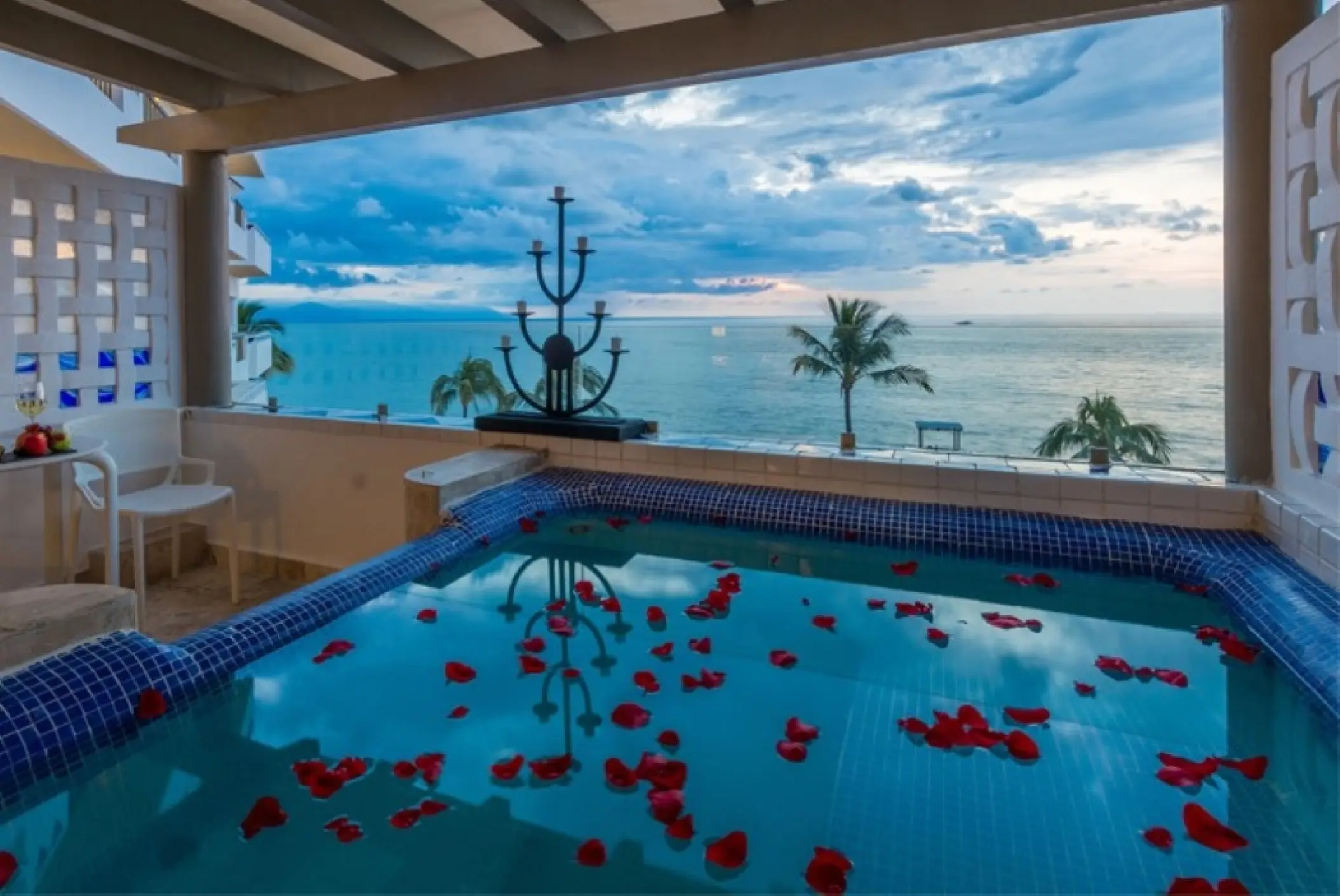 Private balcony jacuzzi with rose petals overlooking the ocean at Villa Premiere Boutique Hotel, Puerto Vallarta