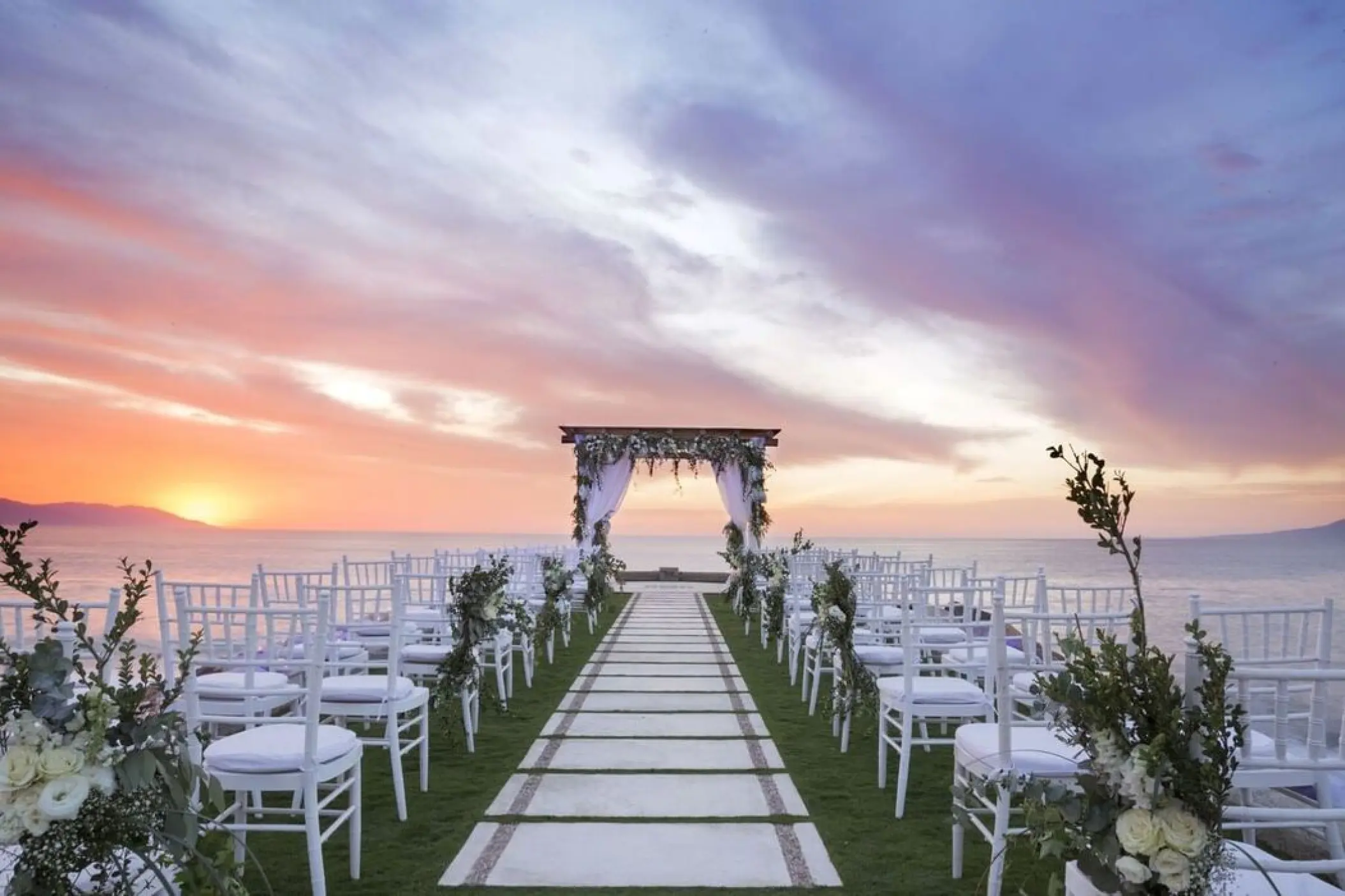 Jetty wedding ceremony setup at sunset, Villa Premiere Boutique Hotel, Puerto Vallarta