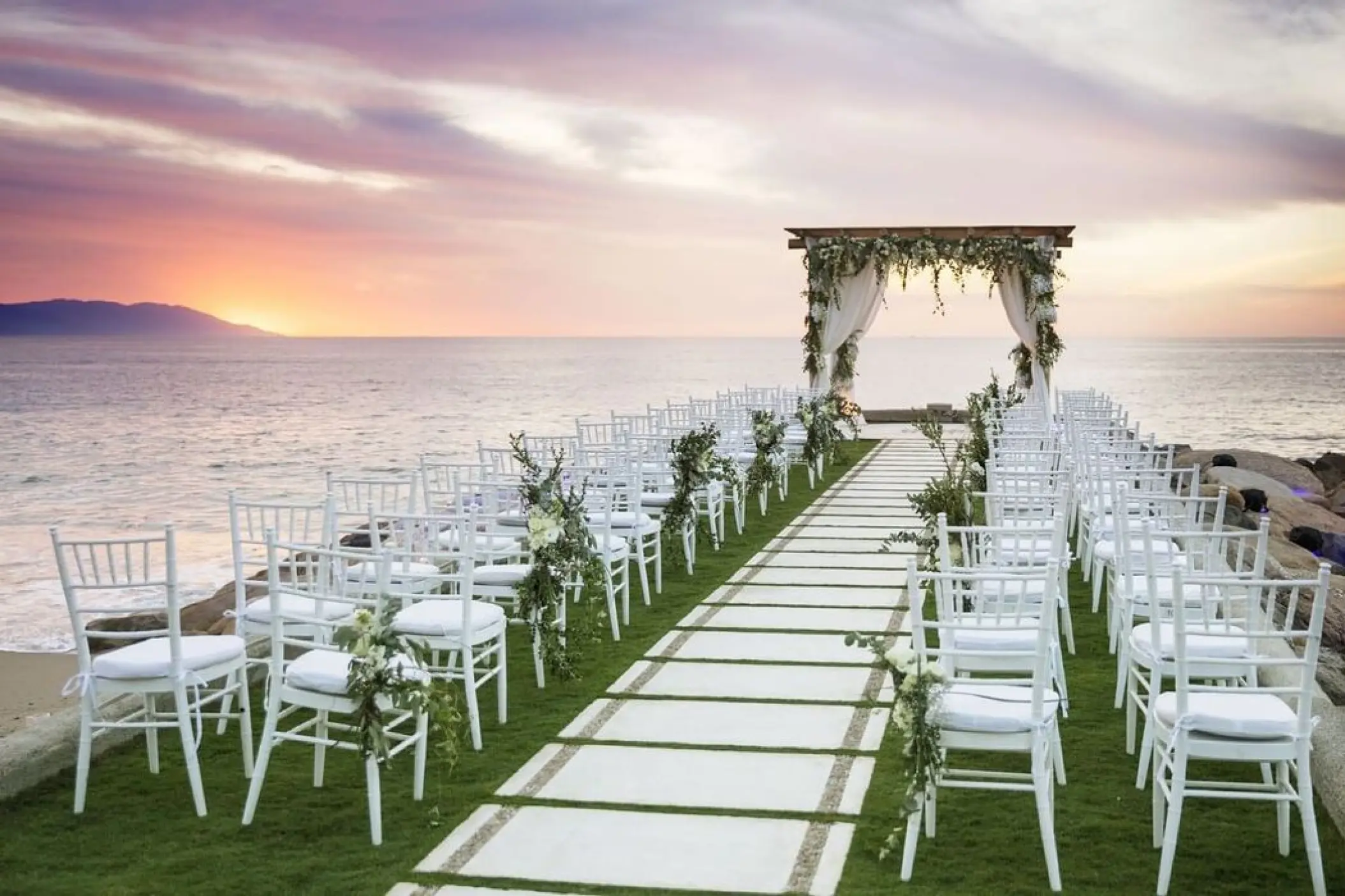 Jetty wedding ceremony setup at sunset at Villa Premiere Boutique Hotel, Puerto Vallarta