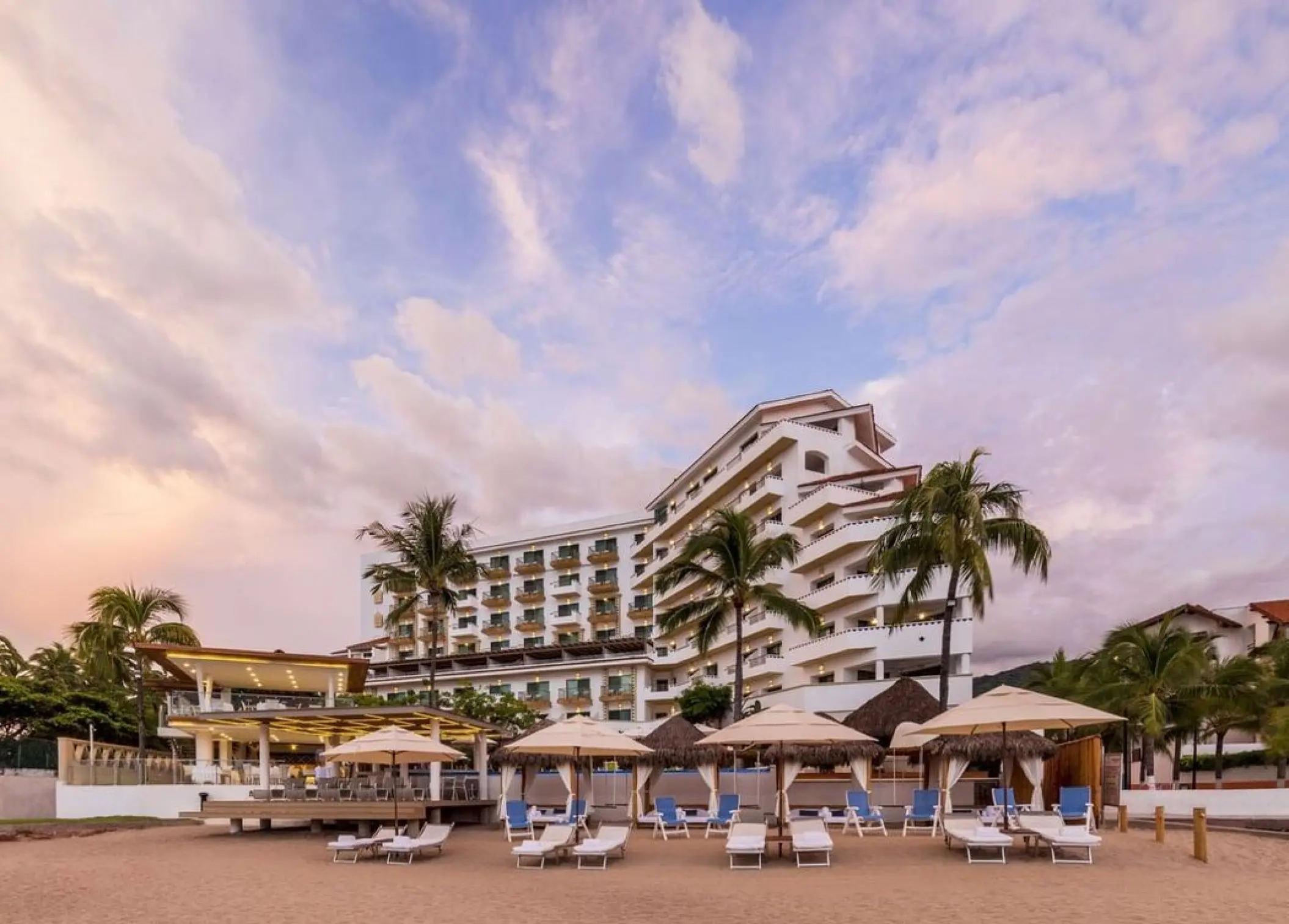 Beachfront exterior and lounge chairs at Villa Premiere Boutique Hotel, Puerto Vallarta