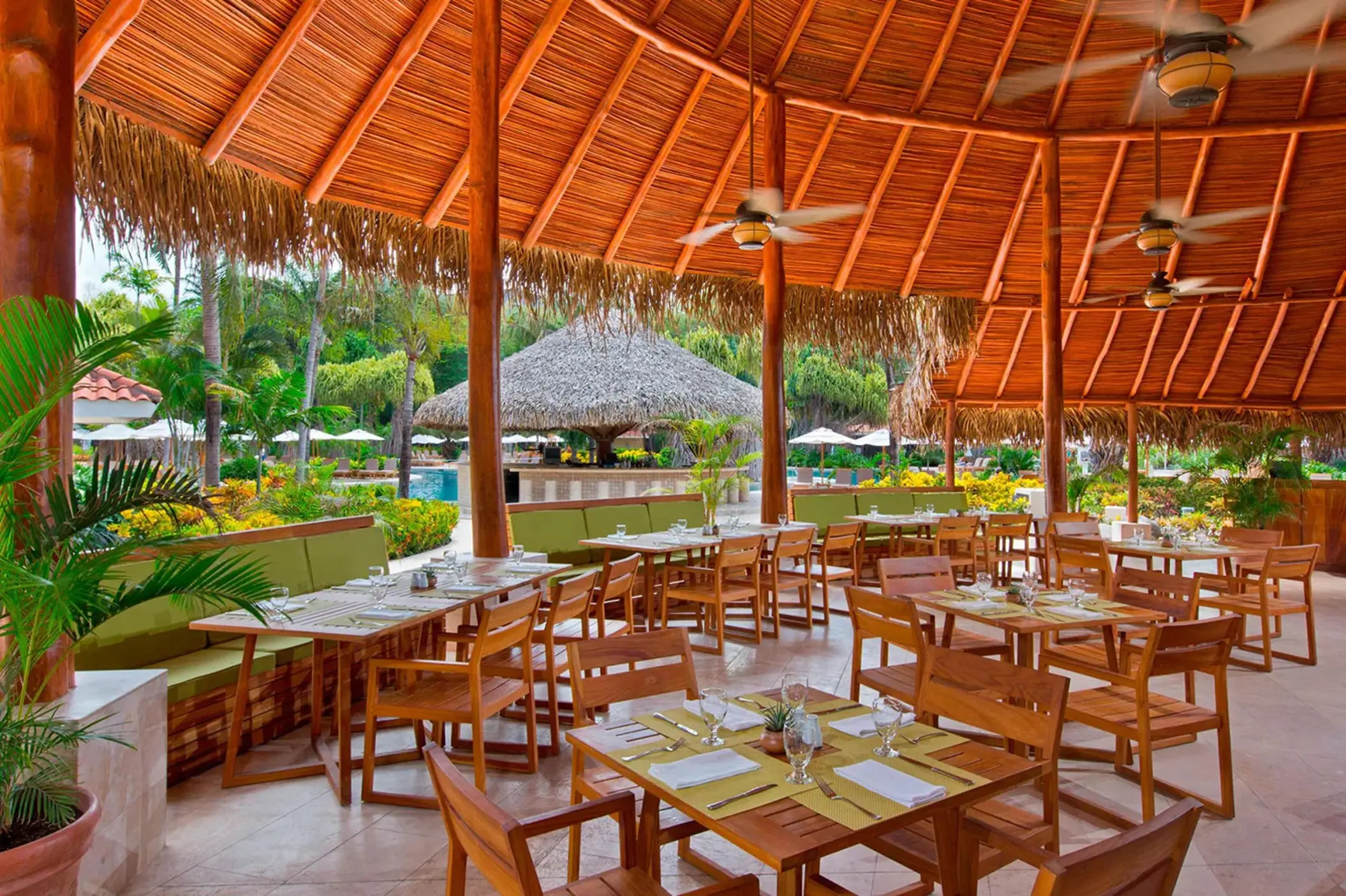 Caracola pool restaurant under a large palapa at Westin Reserva Conchal, Liberia